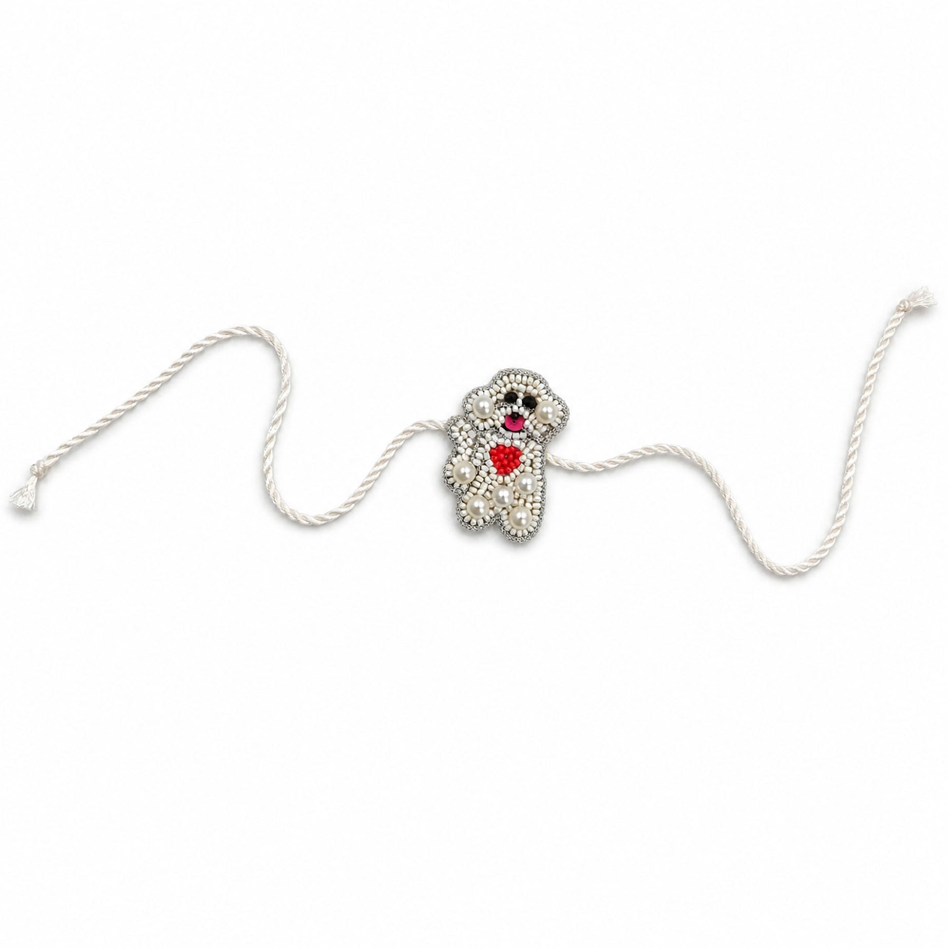 Detailed view of handcrafted pearl beaded teddy rakhi