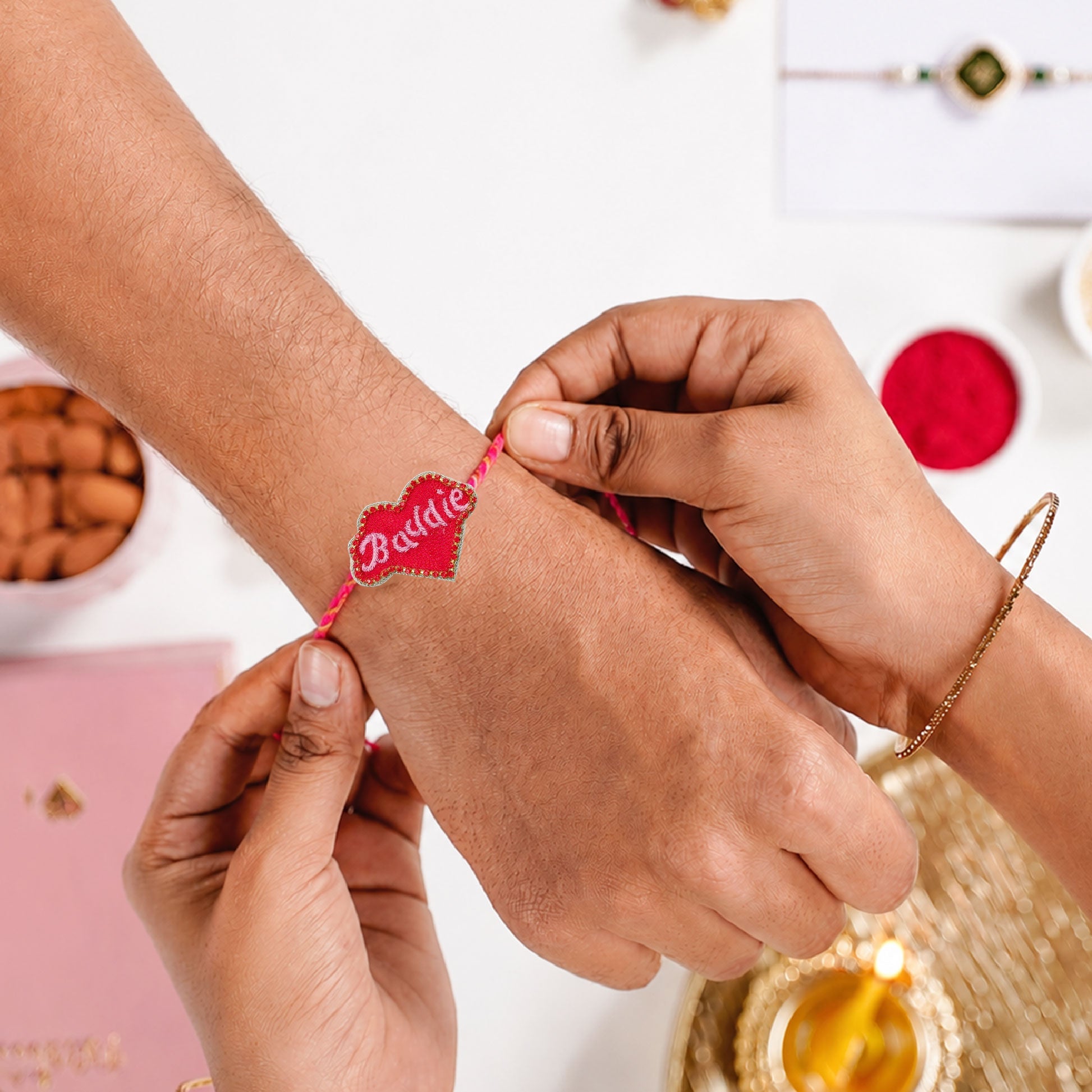 Stylish Dorie heart rakhi with pink braided thread