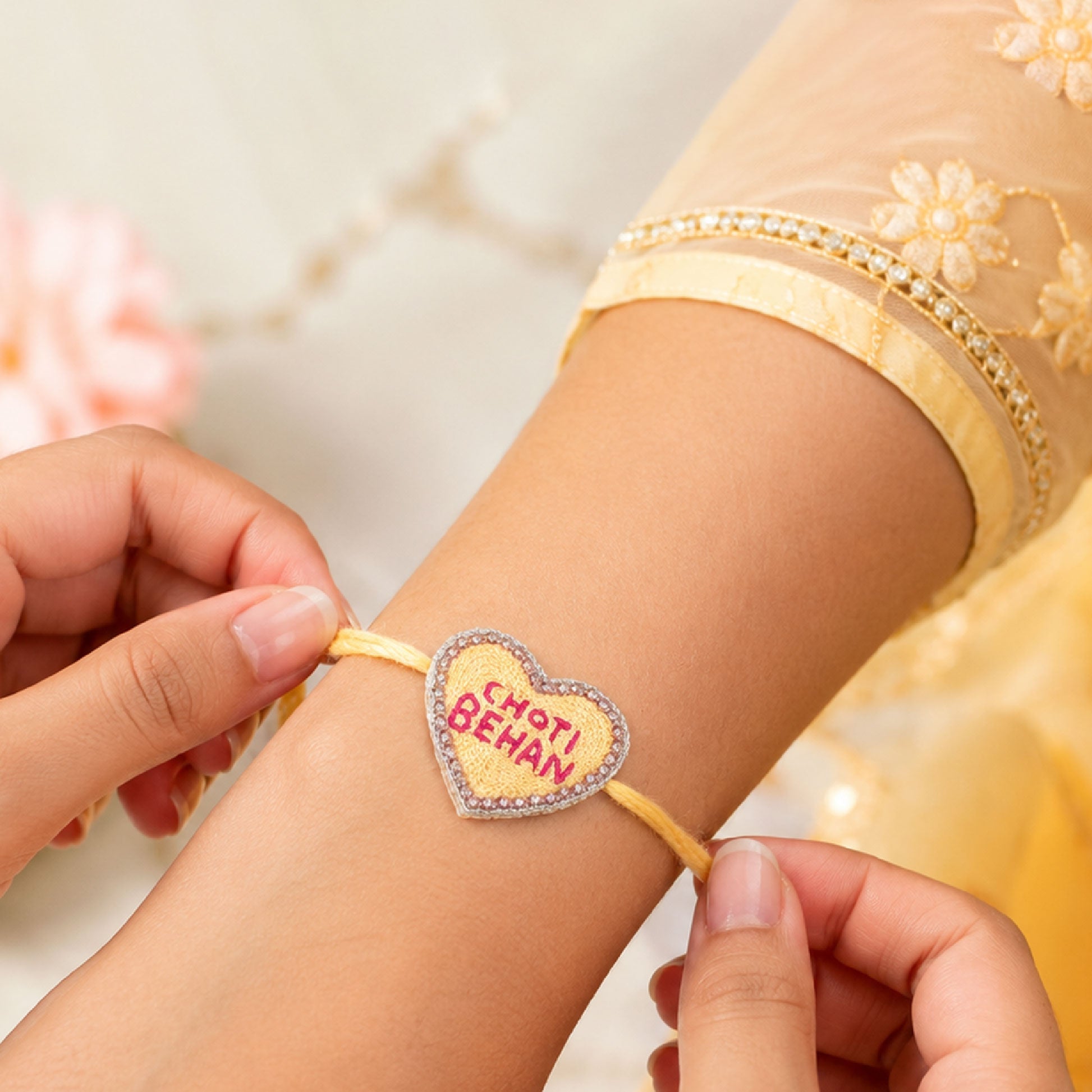 Yellow thread rakhi with Choti Behan heart centerpiece