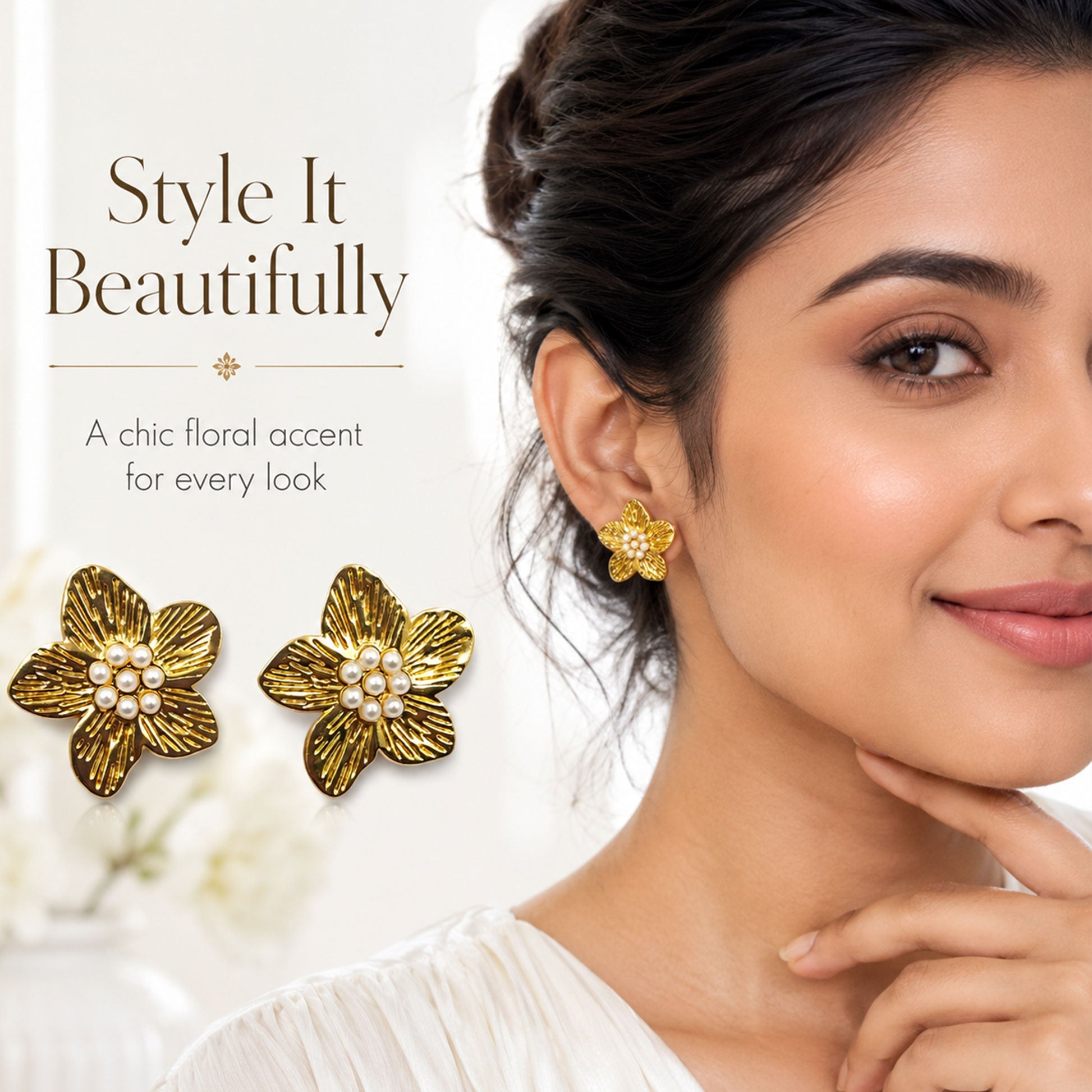 Close-up view of gold floral earrings with pearl centerpiece