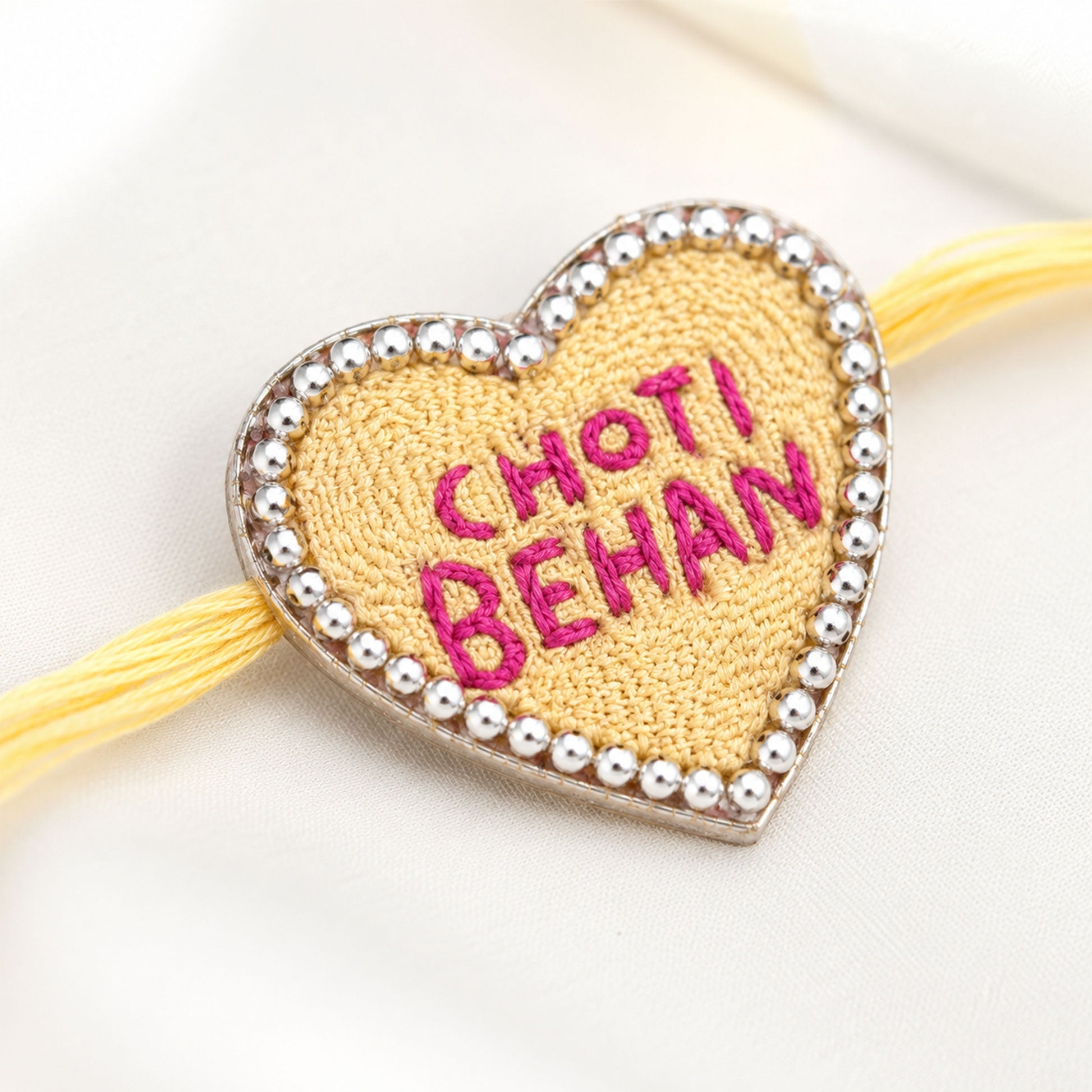 Choti Behan heart rakhi on white background
