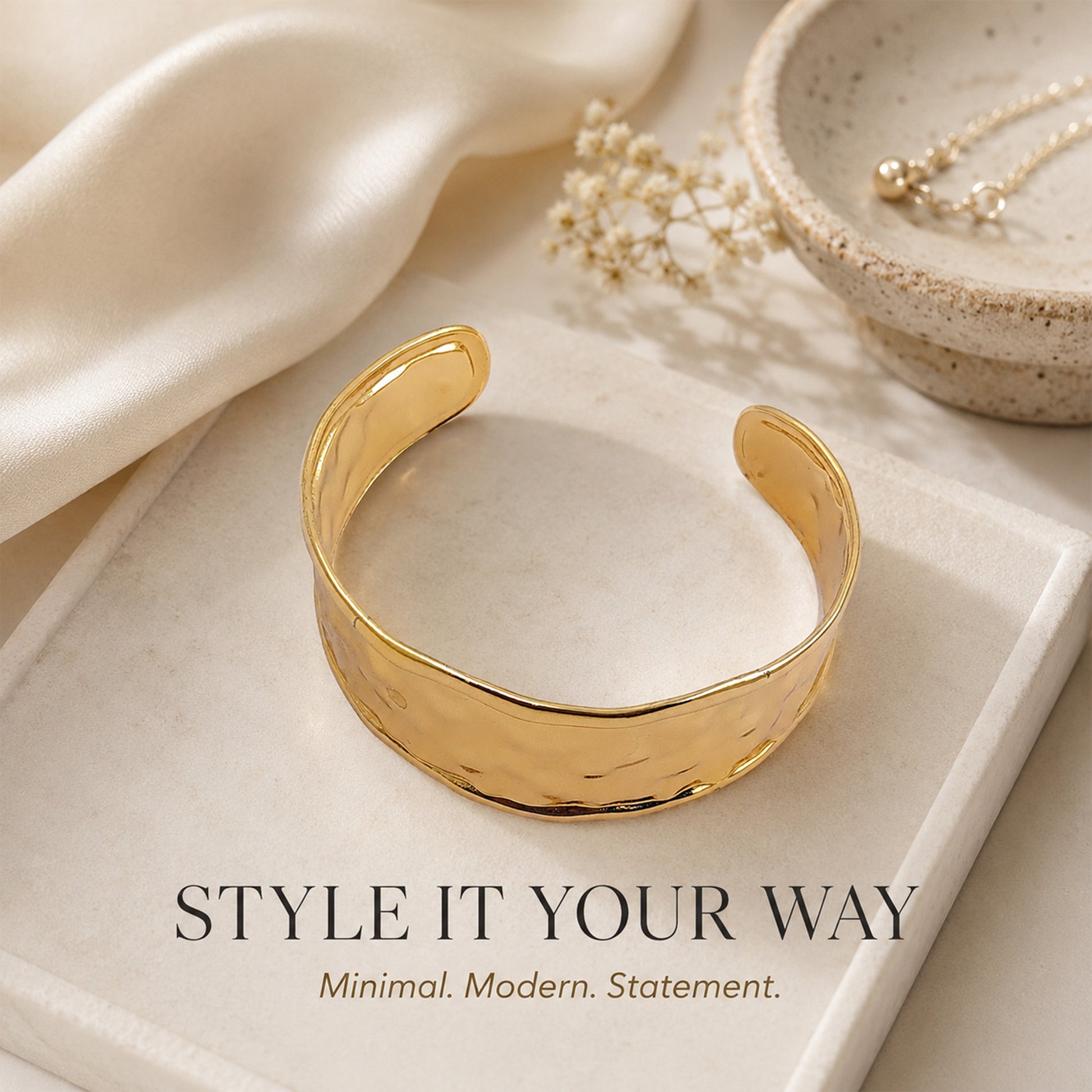 Detailed view of modern gold hammered cuff bracelet
