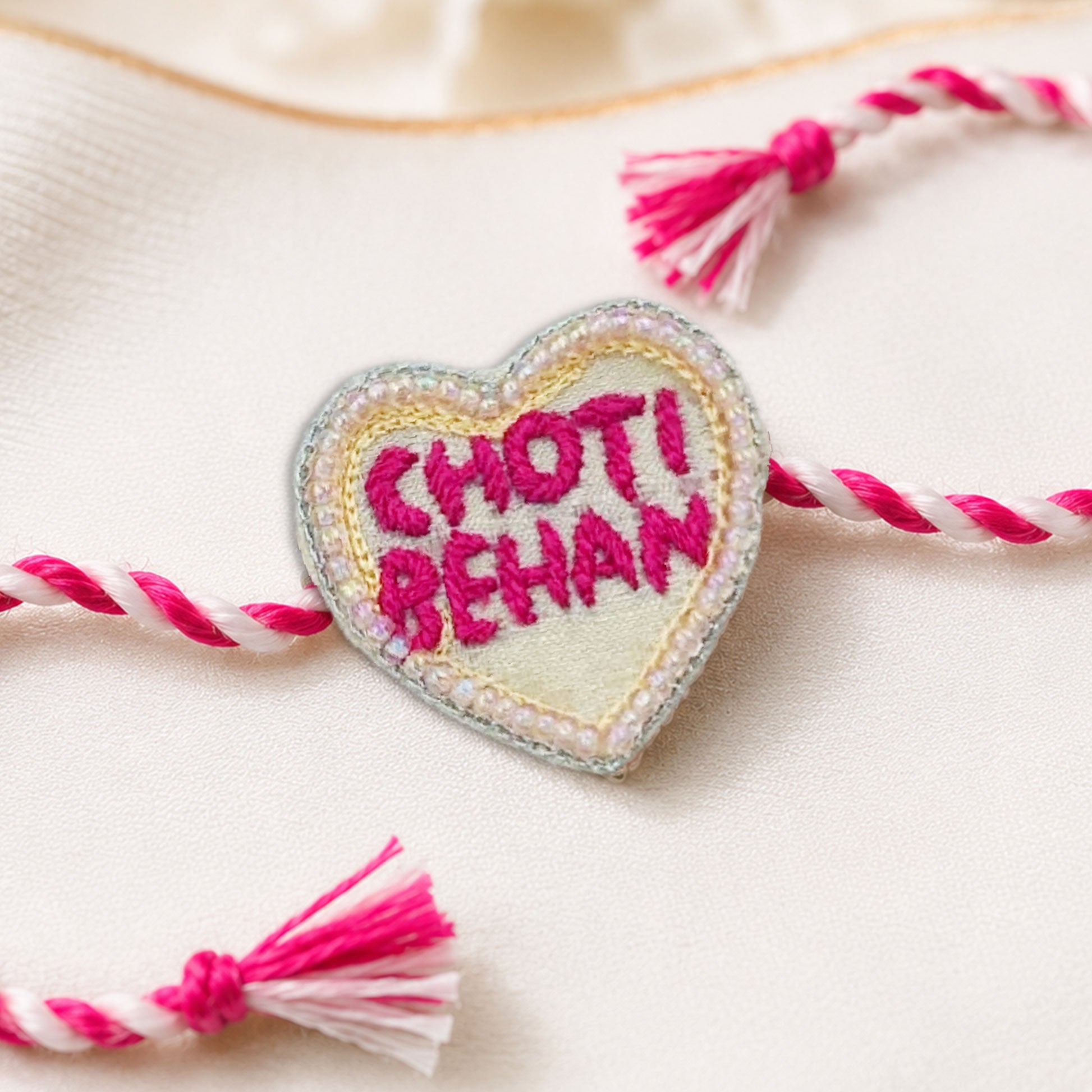 Choti Behan heart rakhi with pink white braided thread