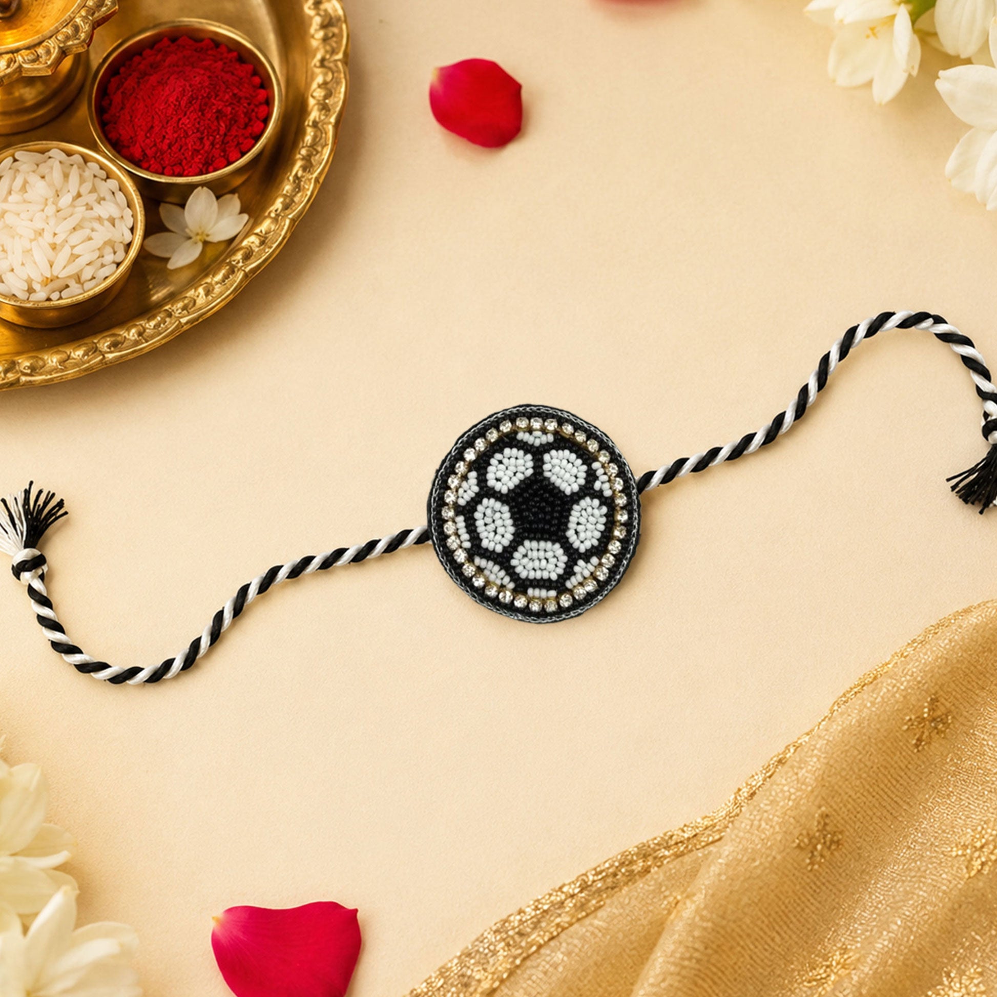 Detailed view of handcrafted black and white beaded rakhi