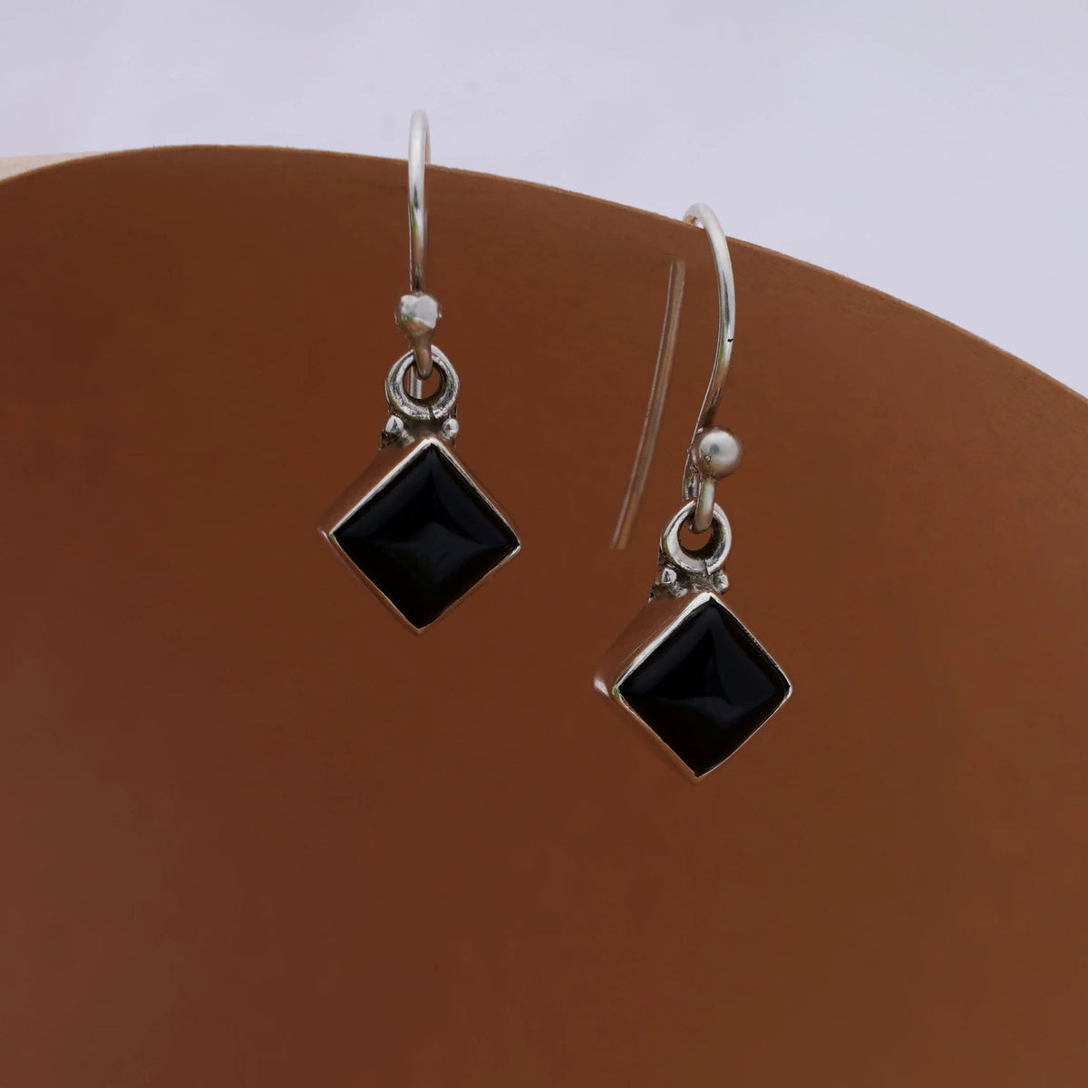925 silver earrings in square faceted black onyx gemstone  in bezel setting handmade with ball earwire in oxidised finish.