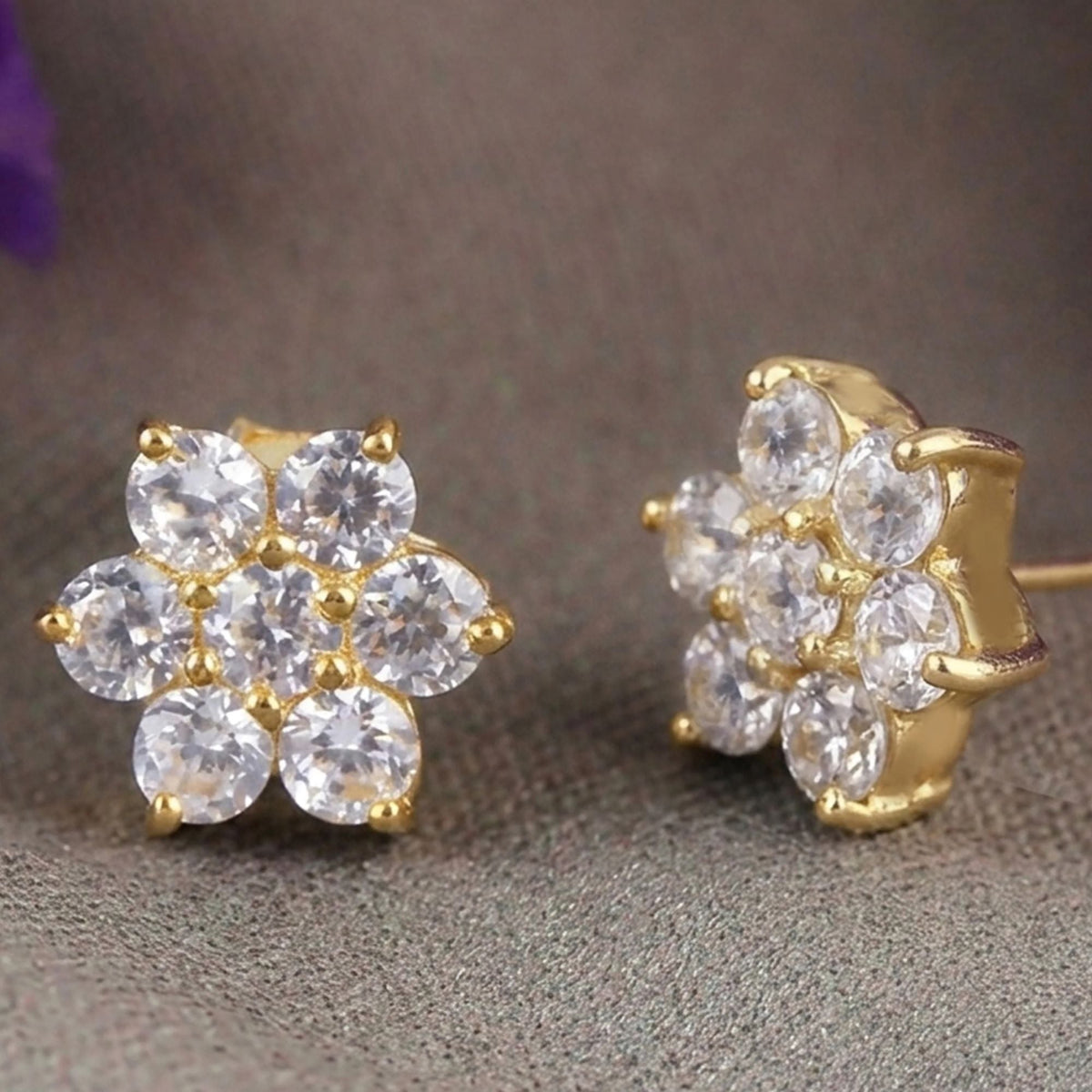 925 Silver eartops in Traditional Girda (Clustre) setting of AD (Zircon) stones with prongs & push closure with gold plating.