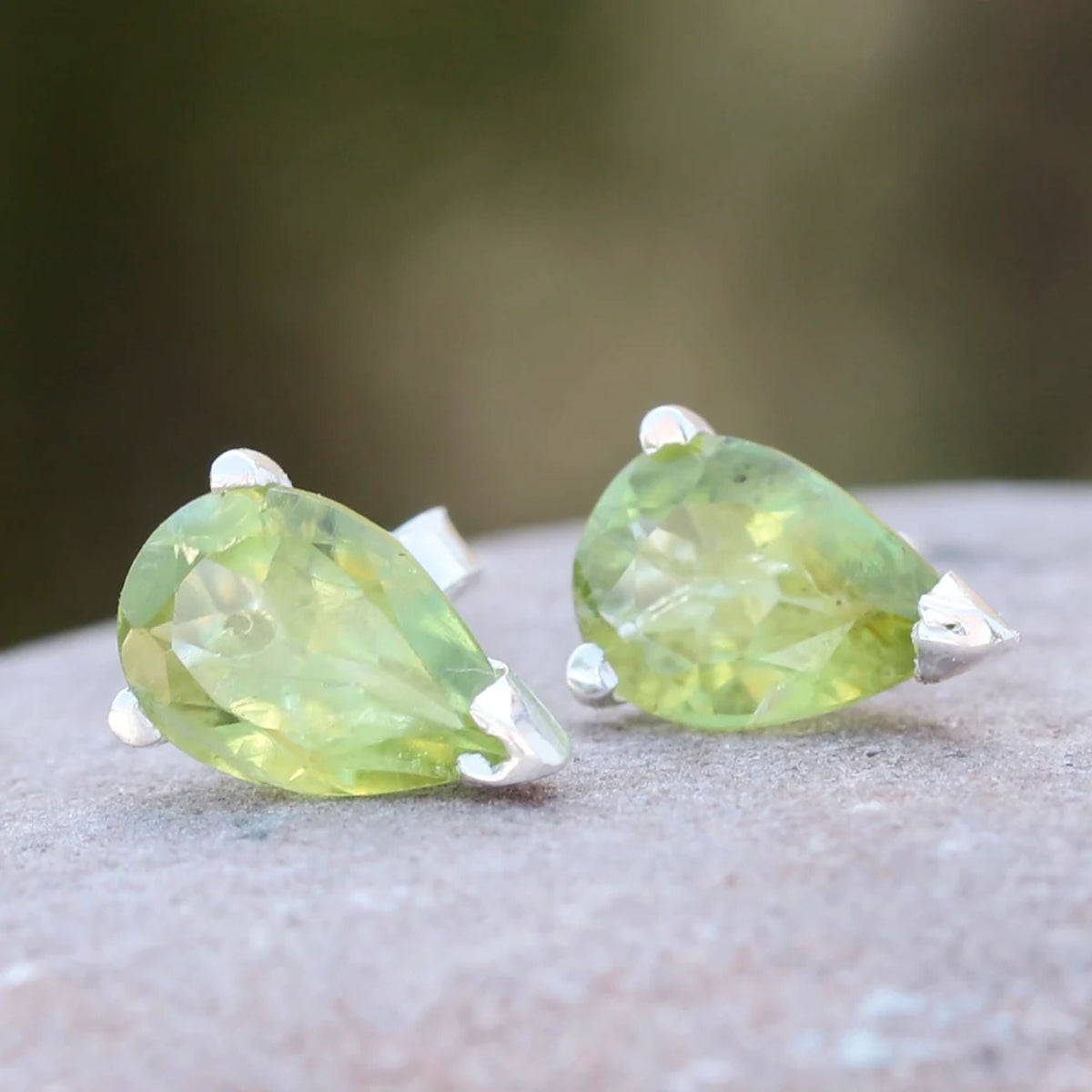 925 Silver Eartops with drop shape faceted Peridot set by hand with Prongs and push closure.