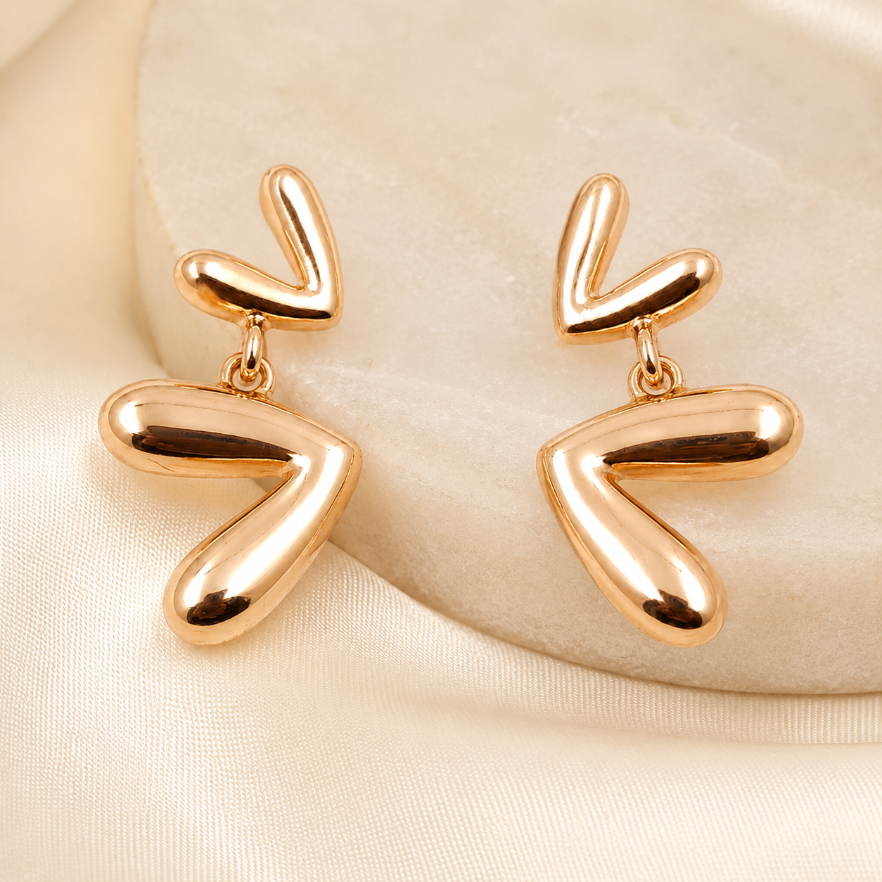 Rose gold plated drop earrings with polished finish