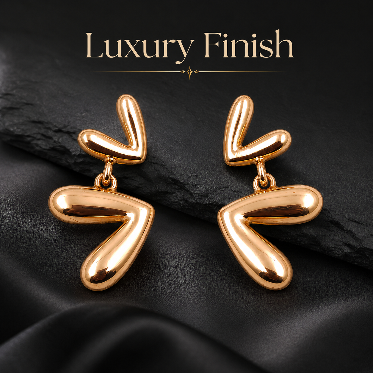 Detailed view of modern abstract rose gold drop earrings