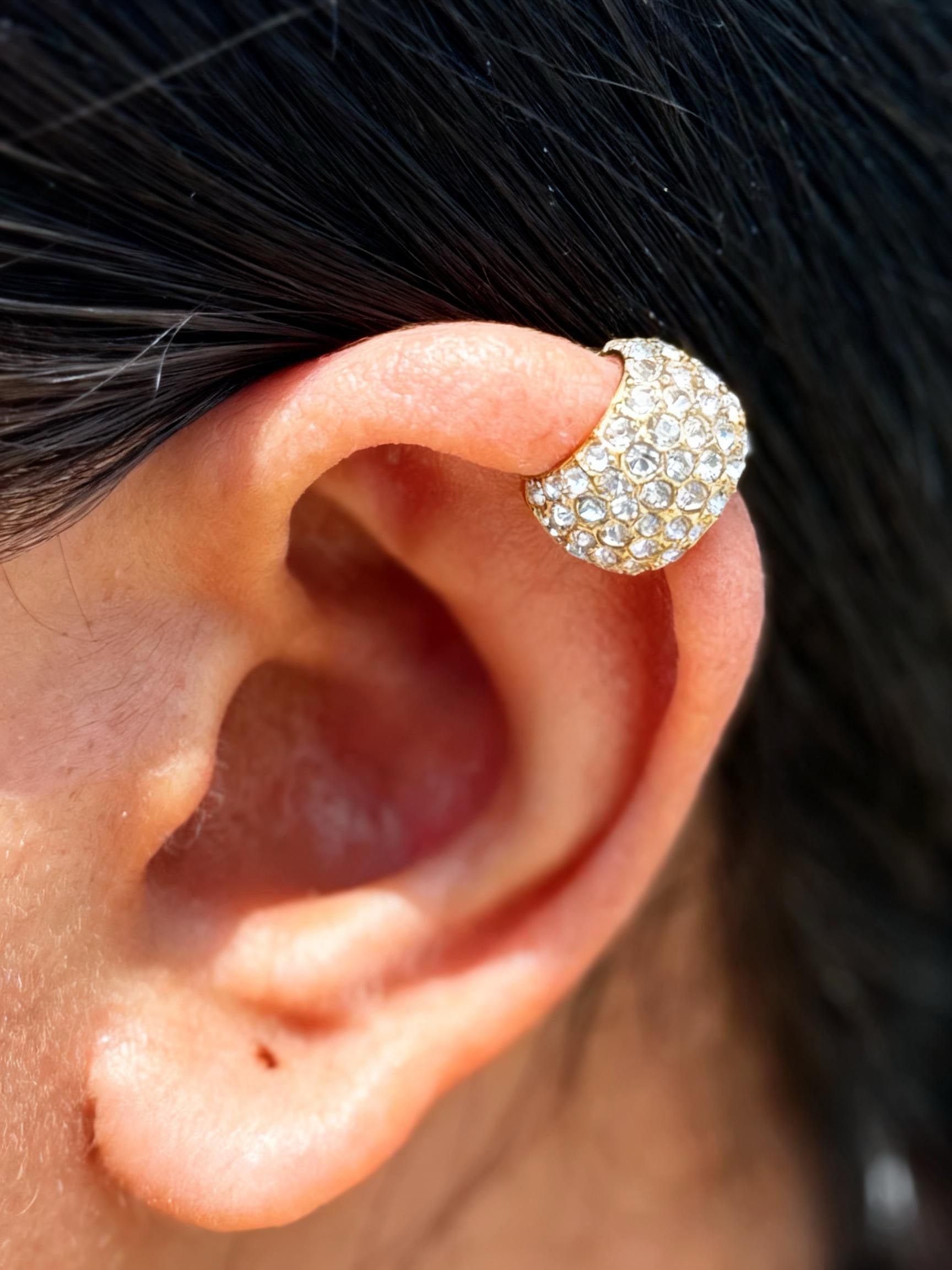 Close-up of chunky gold ear cuff �? bold 18k gold-plated single-piece cuff for festive styling and ear stacks.