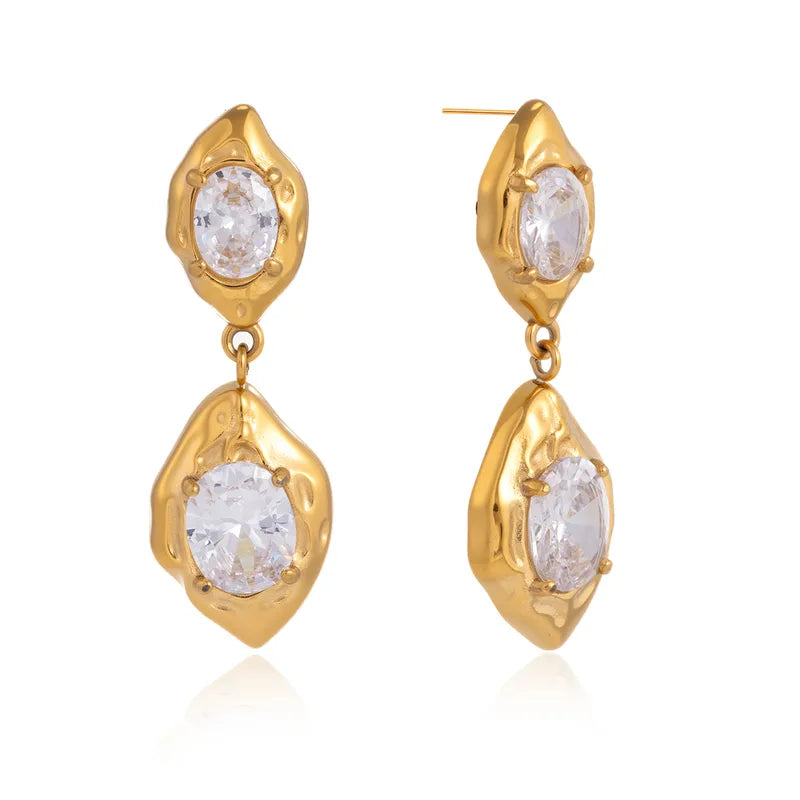 Pair of gold stone drop earrings styled for evening wear �? statement 18k gold-plated drops.