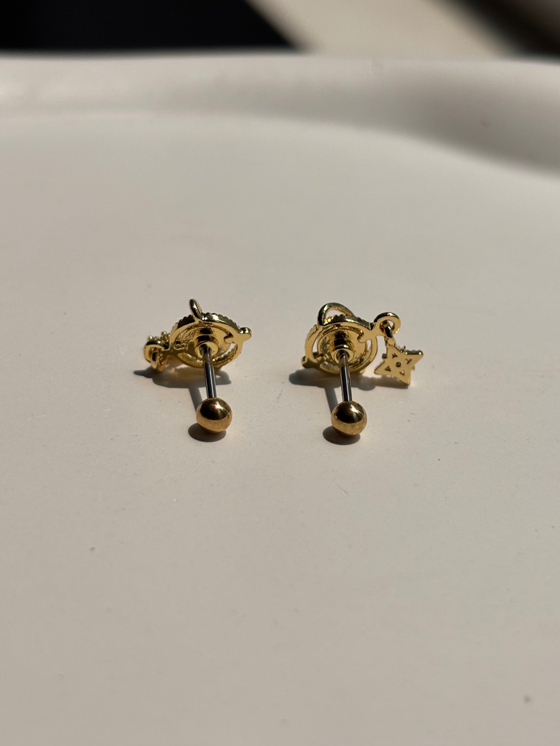 Close-up of 18k gold-plated Eterna ball-back studs �? lightweight, sleep-friendly studs for daily wear.