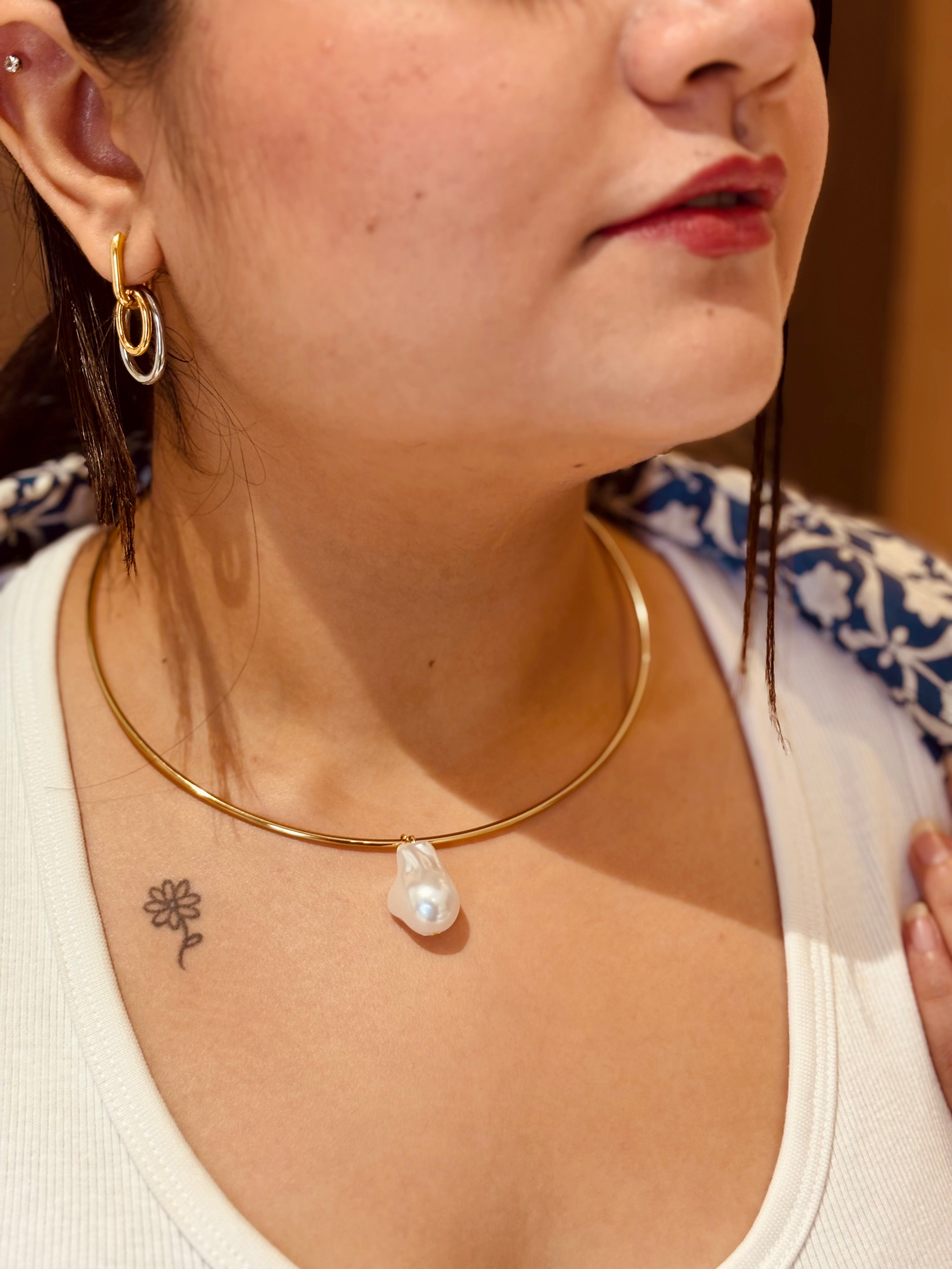 Detail shot of Manya drop earrings �? 18k gold-plated mixed metal drops for everyday and gifting.