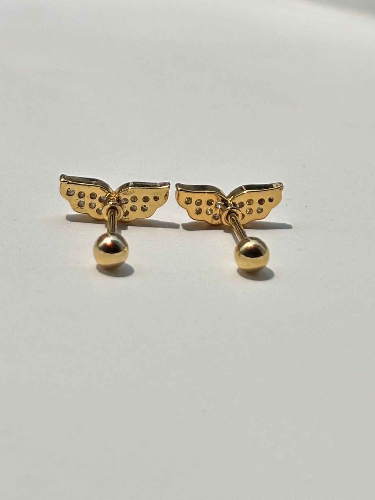 Pair of wing ball-back studs �? 18k gold-plated wing stud earrings for everyday styling and gifting.