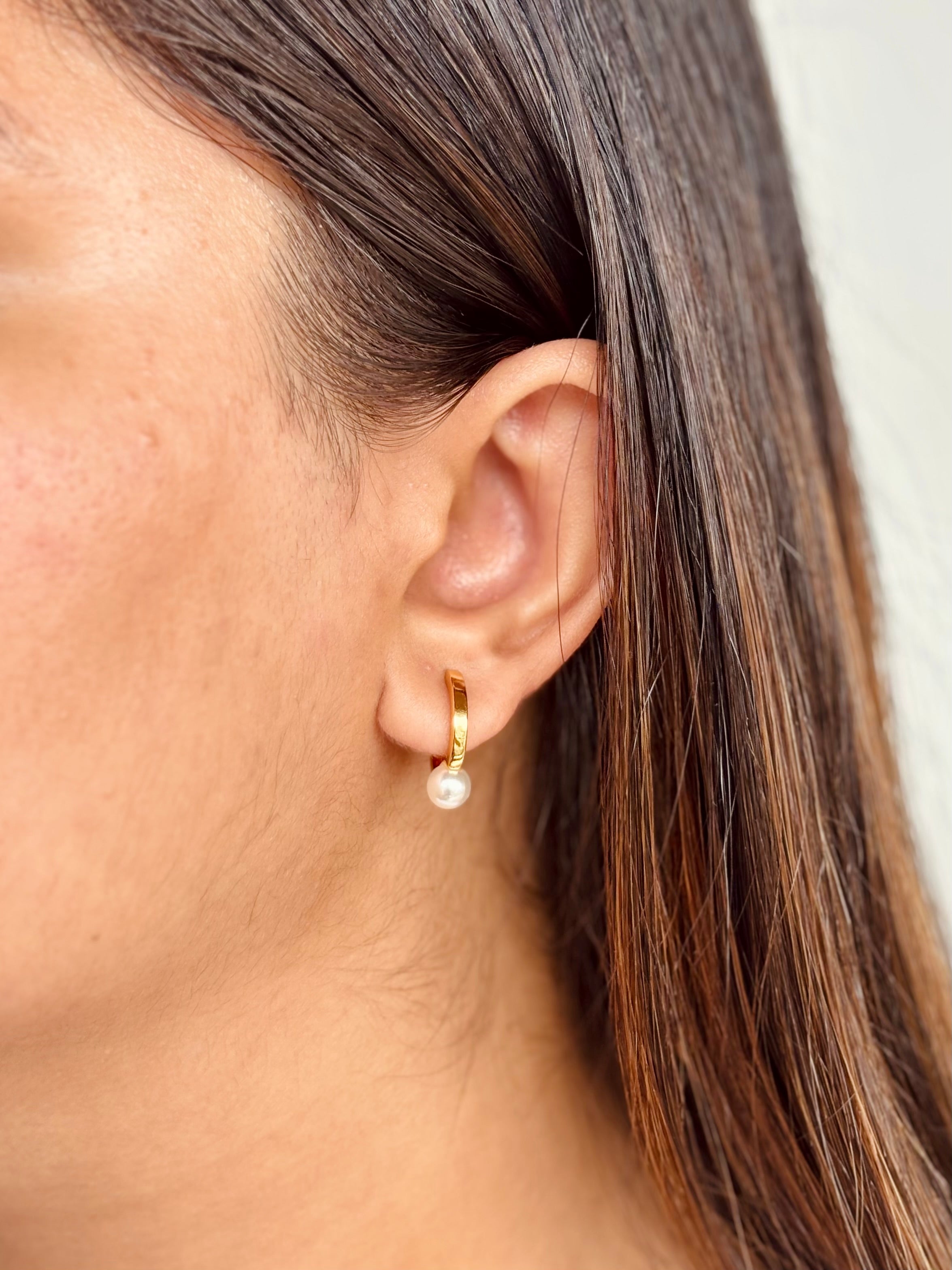 Pair of gold-plated pearl hoop earrings �? everyday-elegant pearl hoops styled for office and evening looks.