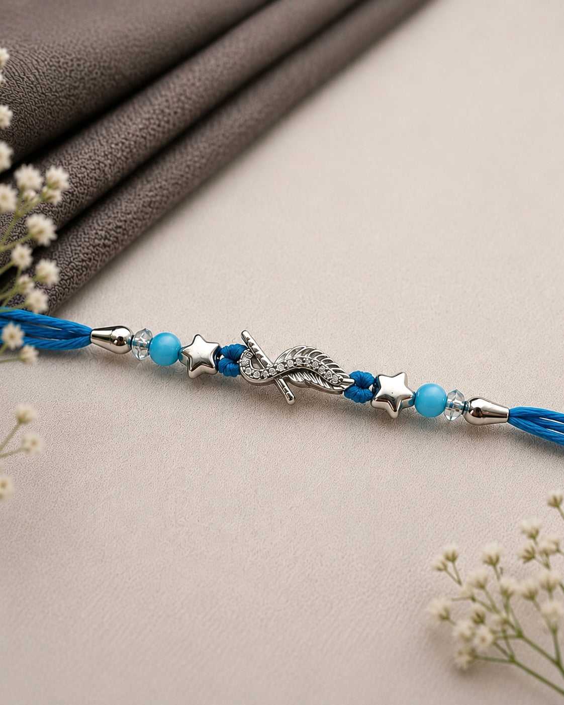 925 Silver Star Wing Rakhi, Blue Thread | House of Diana