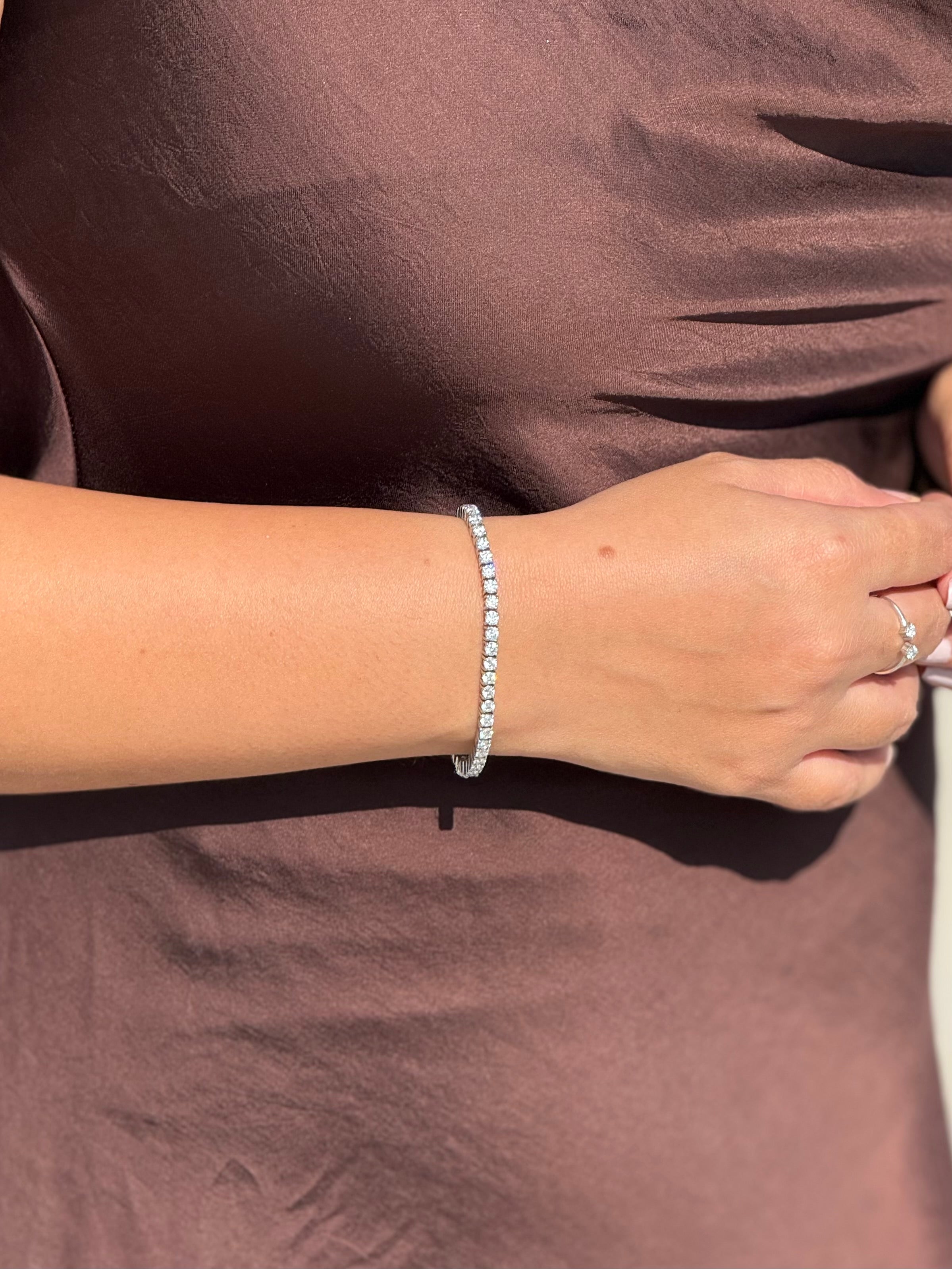 Styled view of moissanite tennis bracelet �? sterling silver diamond-alternative bracelet for everyday-luxury and gifting.