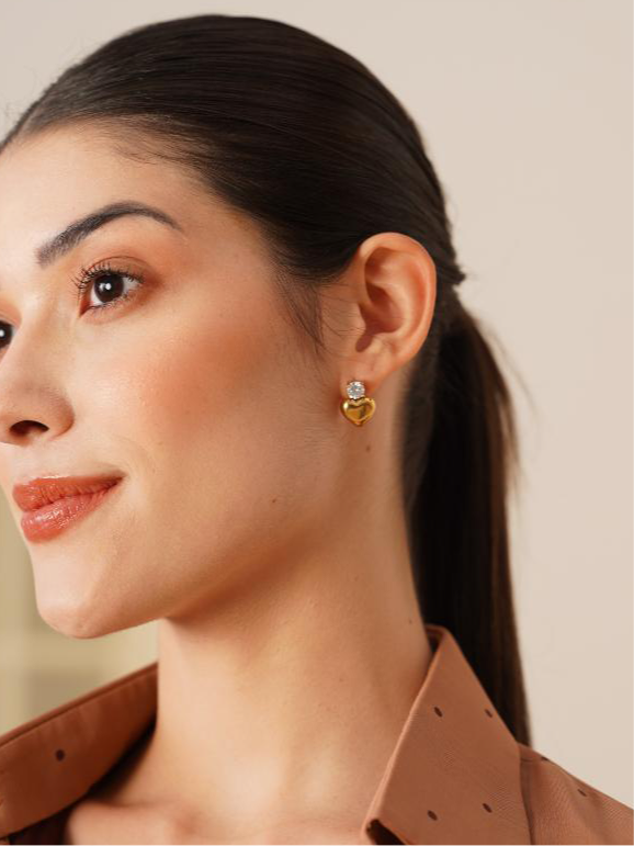Pair of gold-plated heart stone studs �? minimal conversation-starting heart earrings for everyday wear.