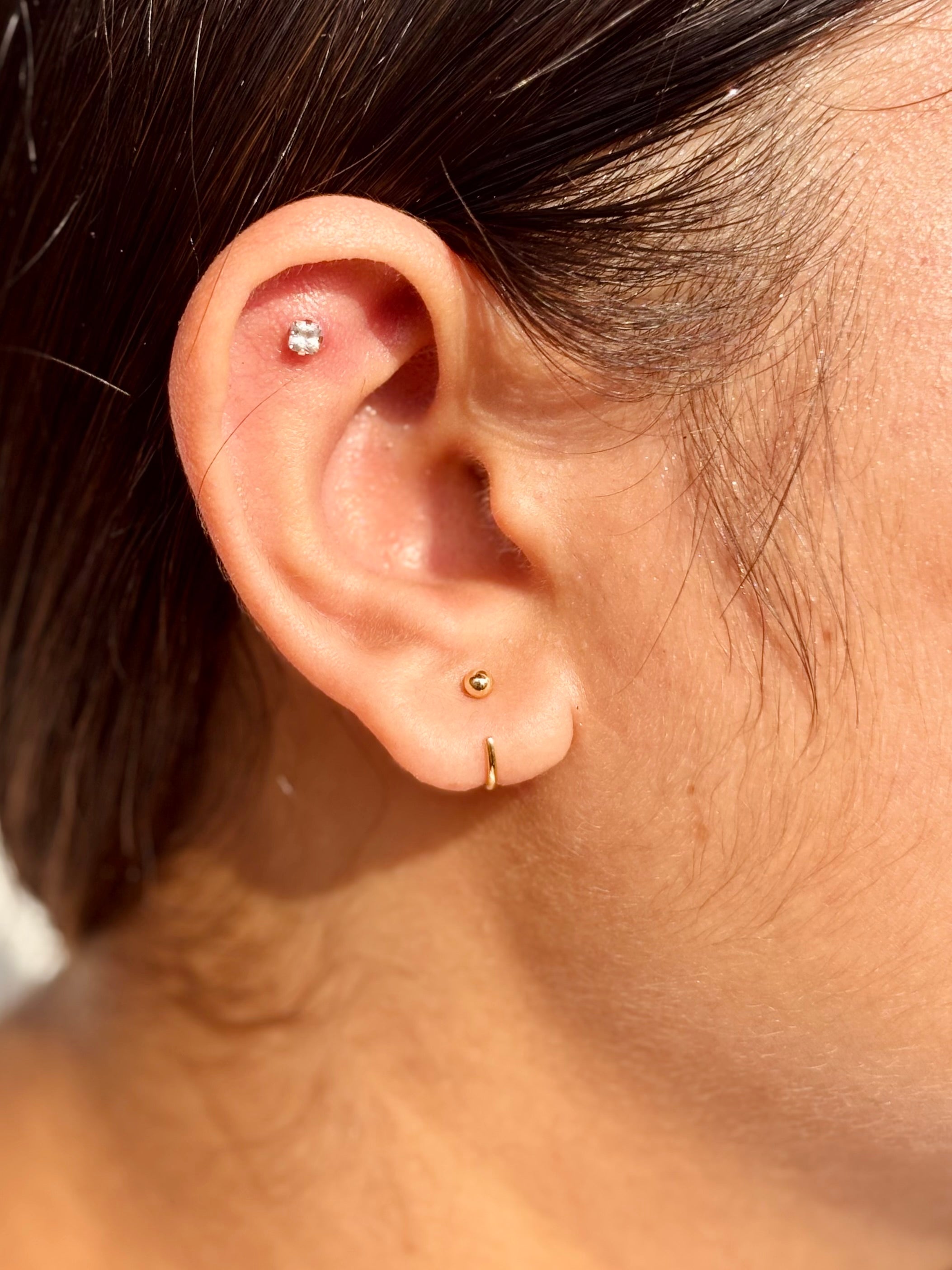 Sterling silver poke-free ball hoop earrings �? lightweight hypoallergenic hoops, safe for kids and sensitive skin.