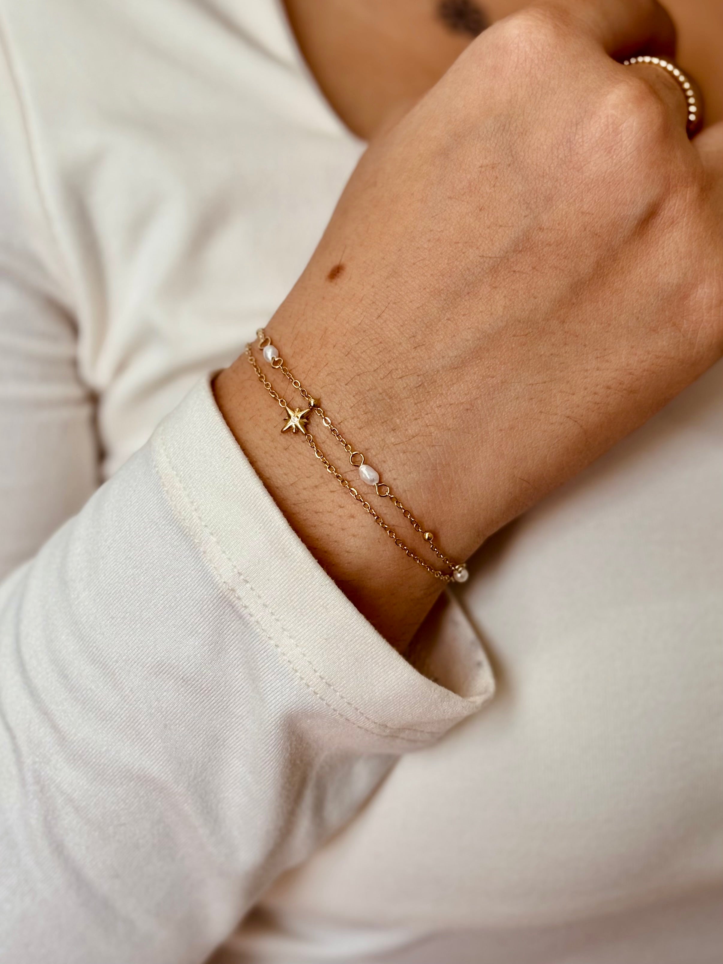Styled view of star pearl bracelet �? 18k gold-plated elegant pearl bracelet for everyday and gifting.