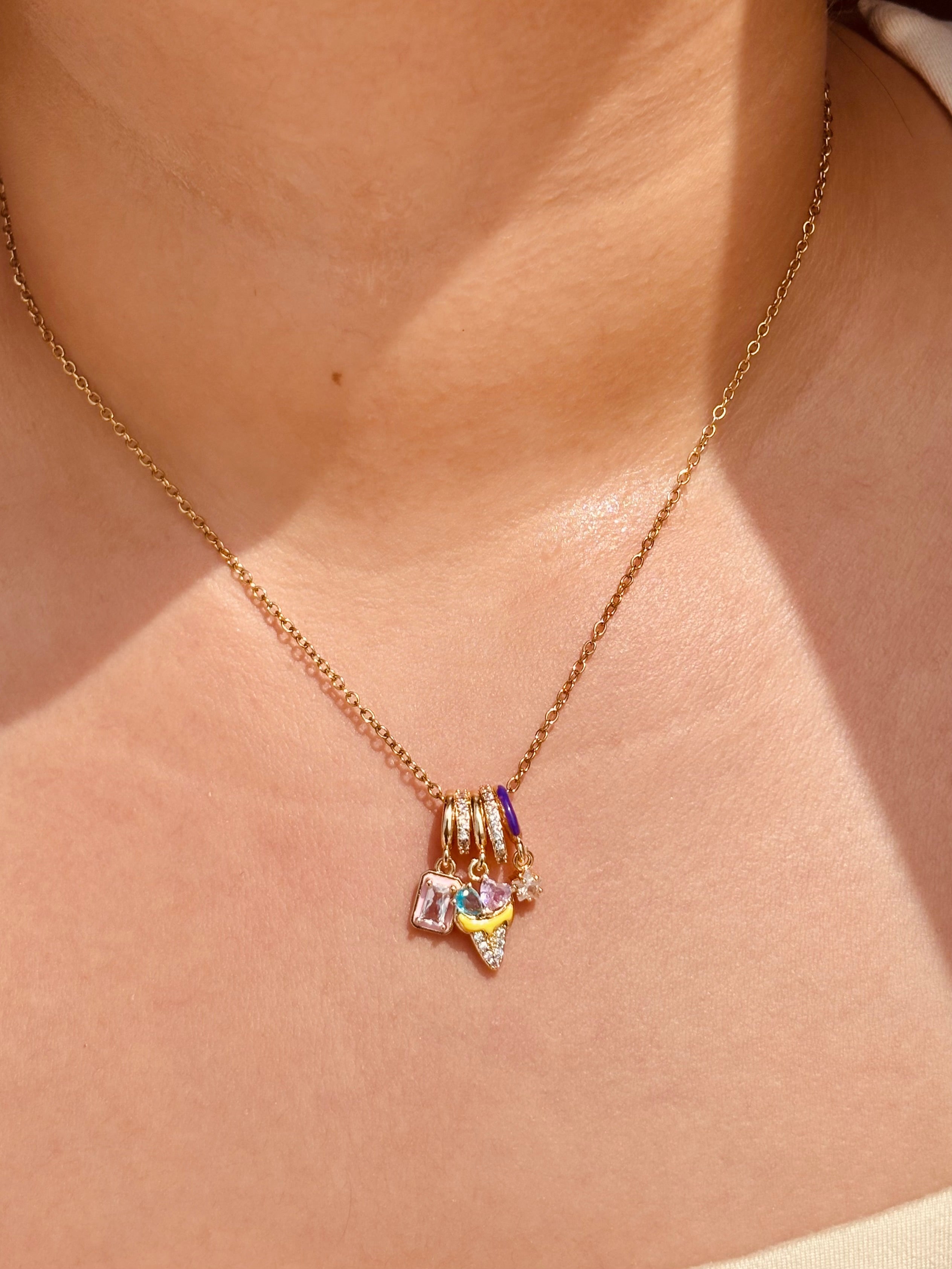 Styled view of Ice Bloom pendant necklace �? playful enamel gemstone charm chain for everyday and gifting.