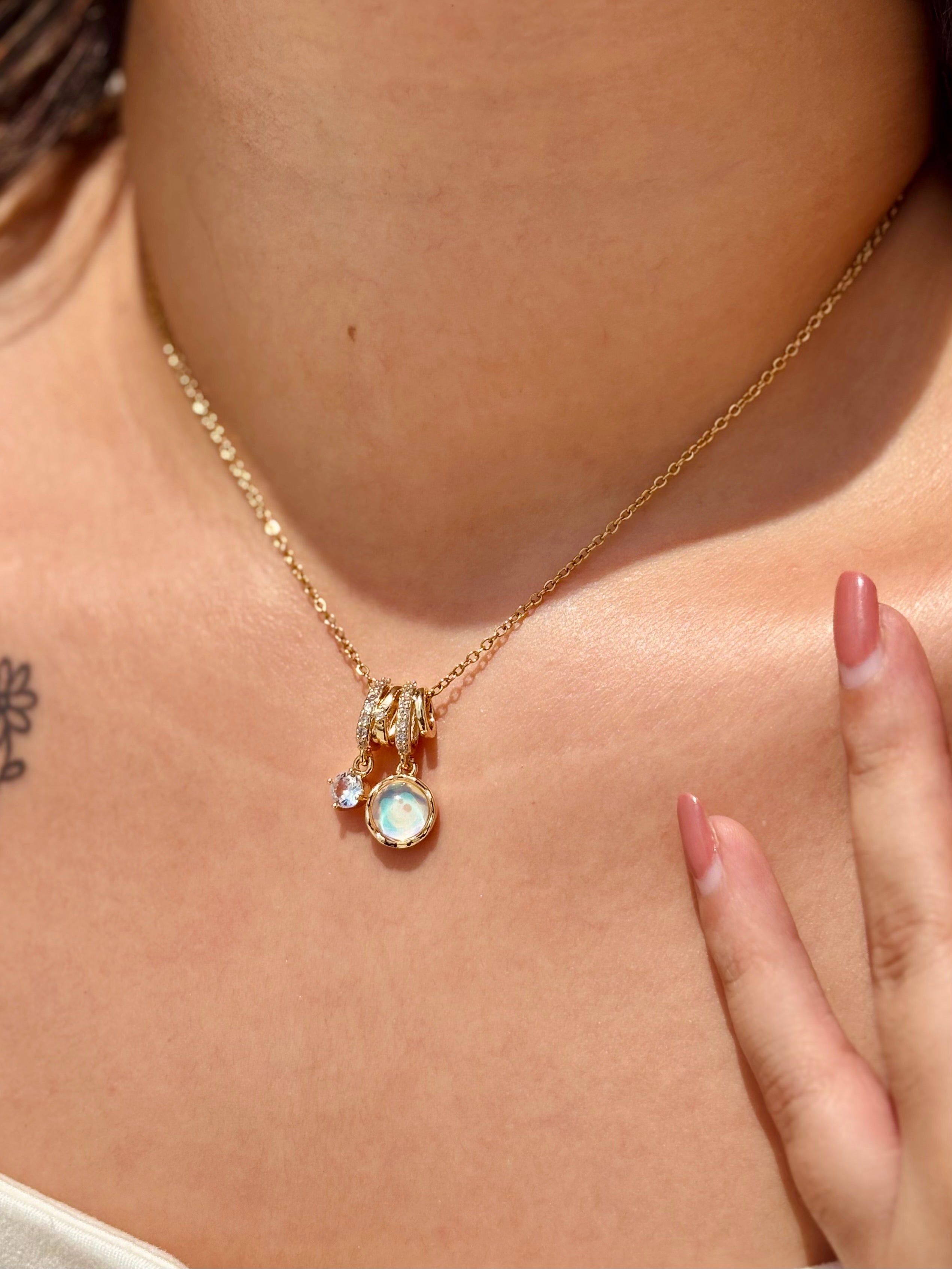 Styled view of Moon Bloom pendant necklace �? chic celestial gemstone necklace for everyday and gifting.