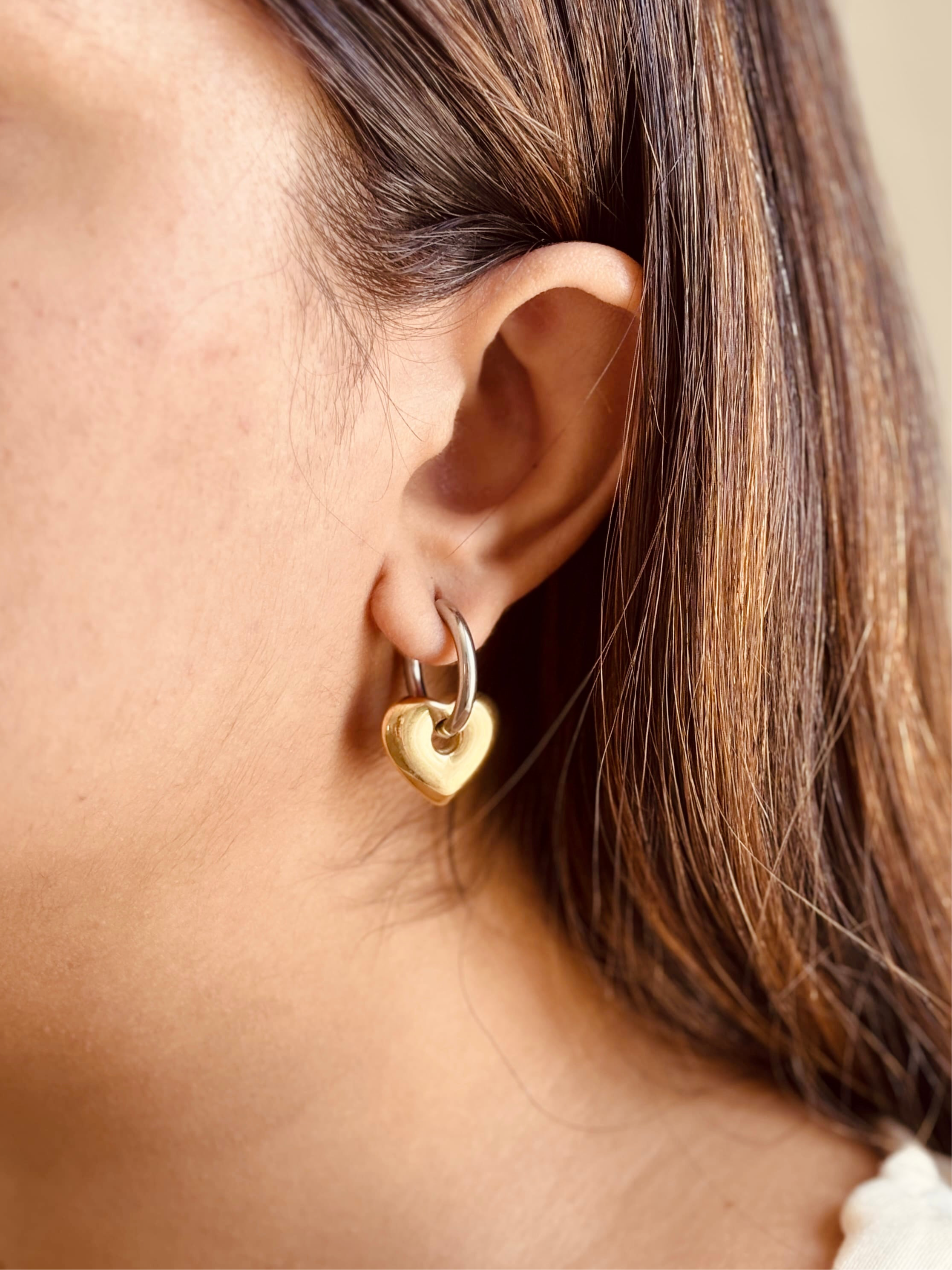 18k gold-plated Love heart hoop earrings �? bold fashion-forward mixed metal heart hoops, anti-tarnish and waterproof for evening and everyday wear.