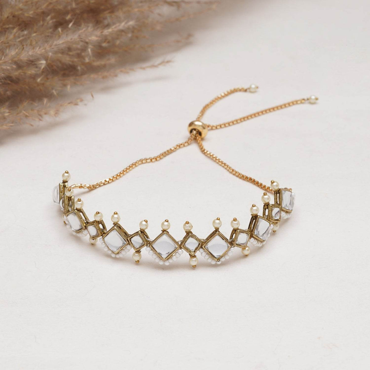 Golden Kite Shaped Kundan With White Pearls Adjustable Bracelet - BeAbhika.com