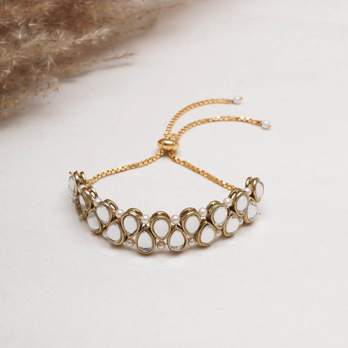 Golden Double Layer Tilak Kundan With White Pearls Adjustable Bracelet - BeAbhika.com