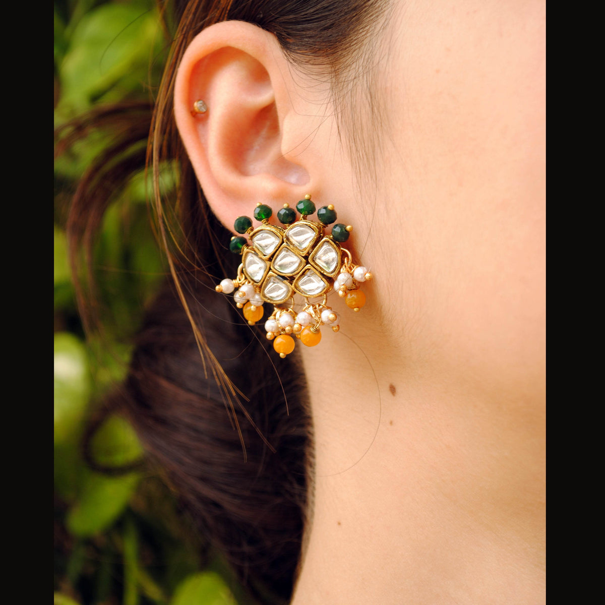 Traditional Kundan earrings in gold-tone, perfect for weddings and festive wear