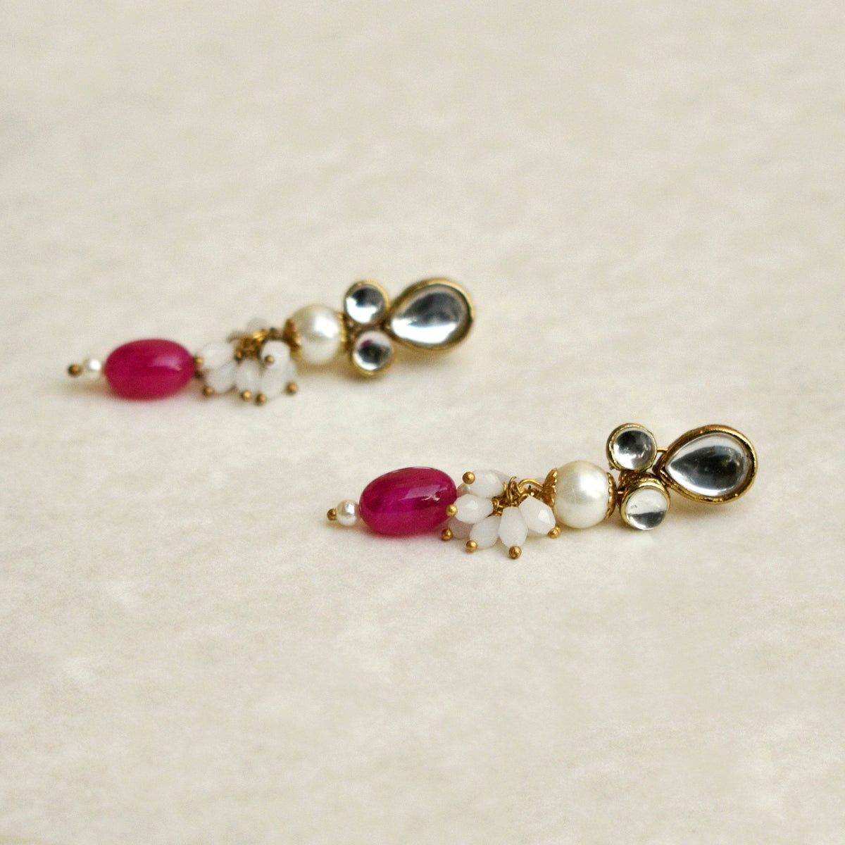 Traditional Kundan earrings in gold-tone, perfect for weddings and festive wear