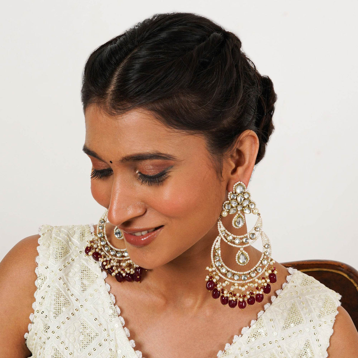 Traditional Kundan earrings in gold-tone, perfect for weddings and festive wear