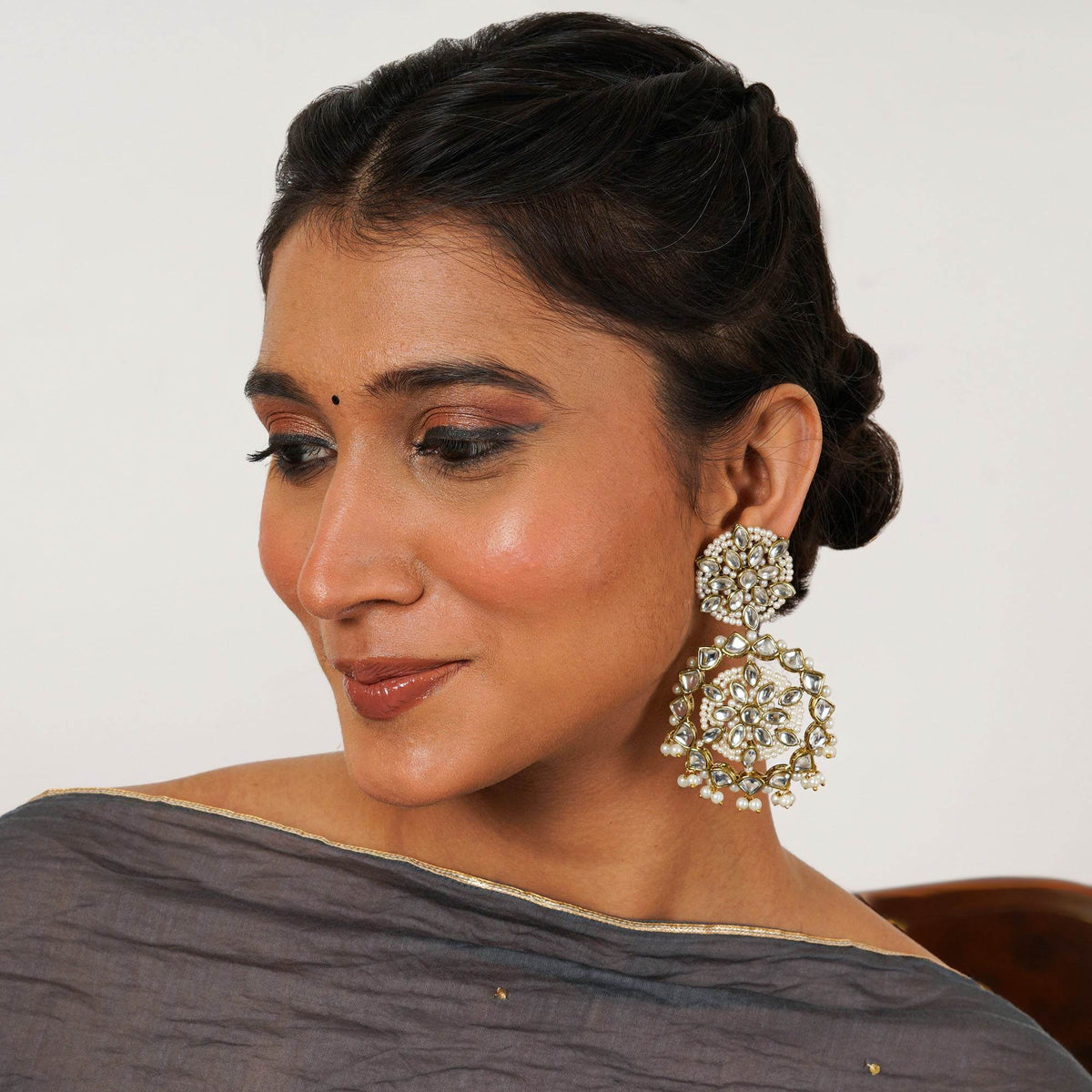 Traditional Kundan earrings in gold-tone, perfect for weddings and festive wear
