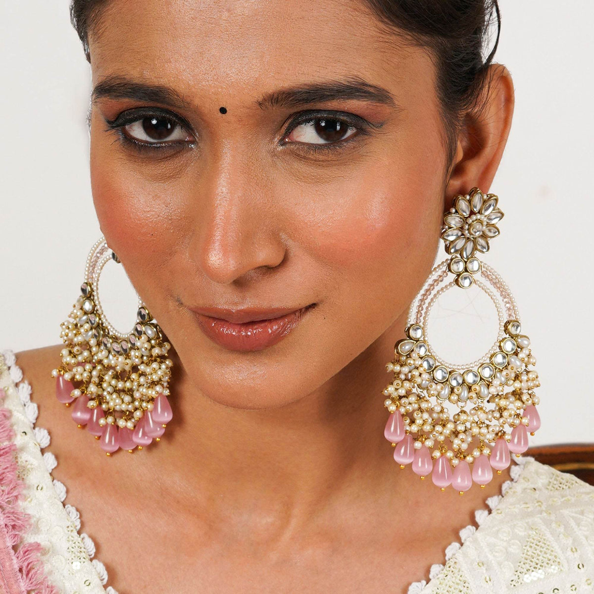 Traditional Kundan earrings in gold-tone, perfect for weddings and festive wear