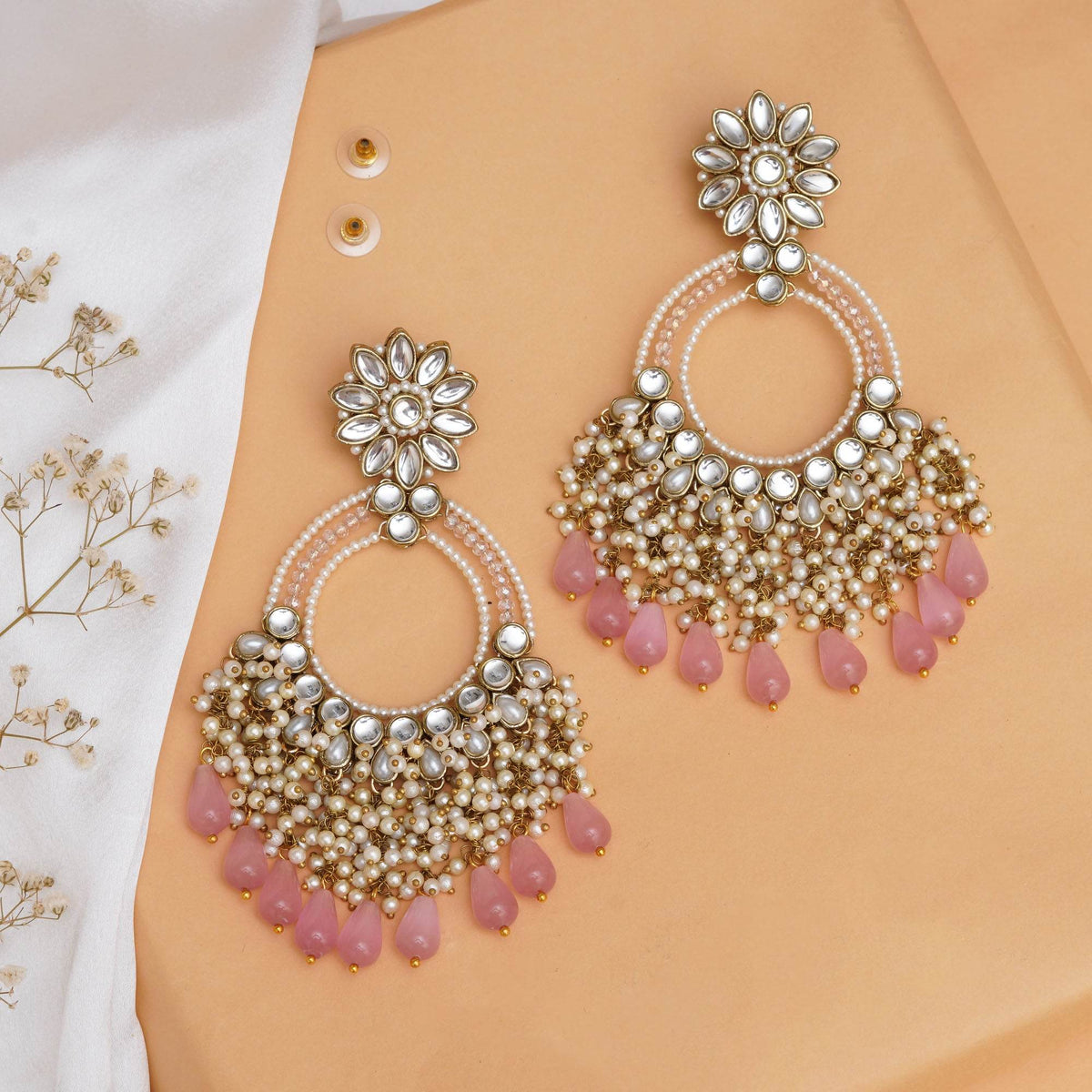 Traditional Kundan earrings in gold-tone, perfect for weddings and festive wear
