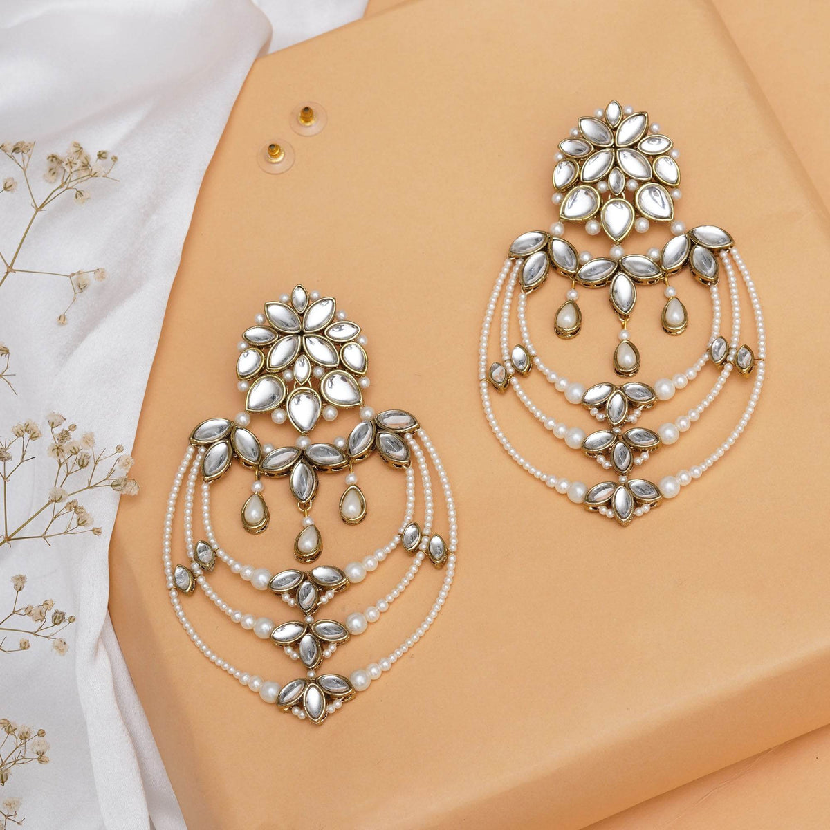 Traditional Kundan earrings in gold-tone, perfect for weddings and festive wear