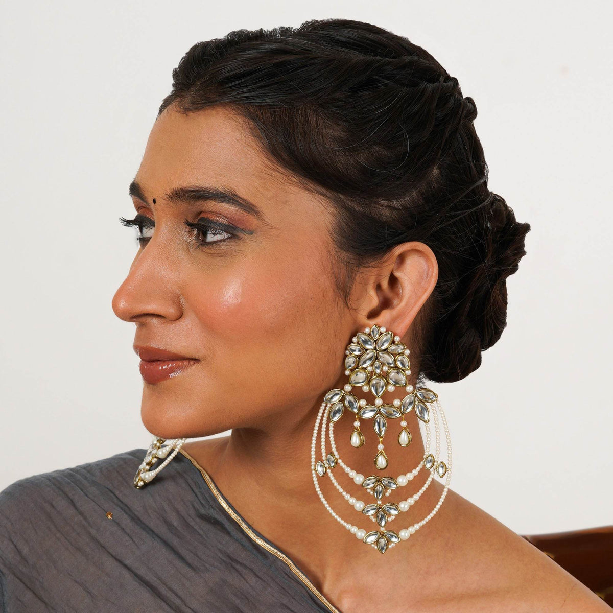 Traditional Kundan earrings in gold-tone, perfect for weddings and festive wear