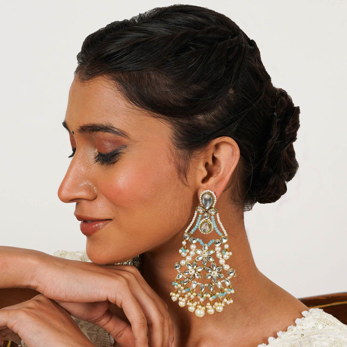 Traditional Kundan earrings in gold-tone, perfect for weddings and festive wear