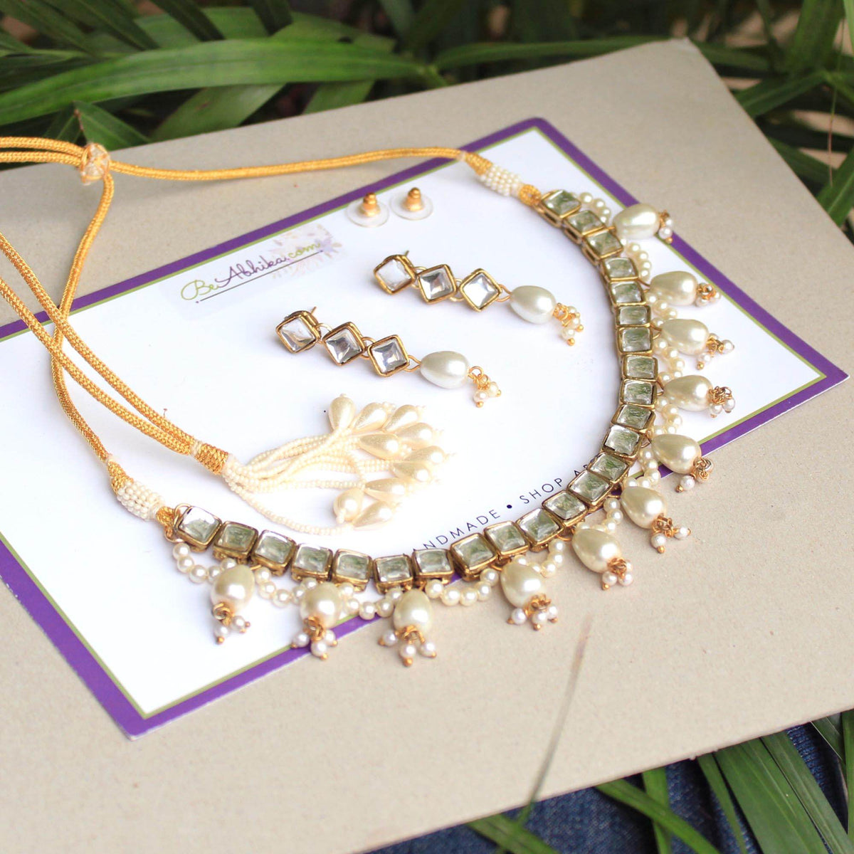 Kundan choker set in gold-tone with matching earrings and long bridal necklace, perfect for wedding functions , festive and bridal wear