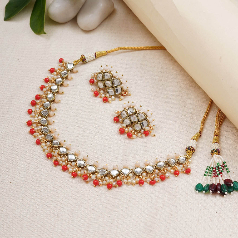 Kundan choker set in gold-tone with matching earrings and long bridal necklace, perfect for wedding functions , festive and bridal wear
