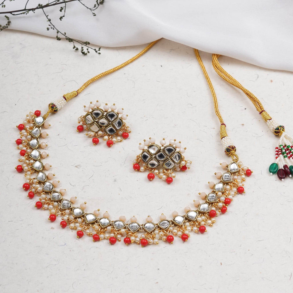 Kundan choker set in gold-tone with matching earrings and long bridal necklace, perfect for wedding functions , festive and bridal wear