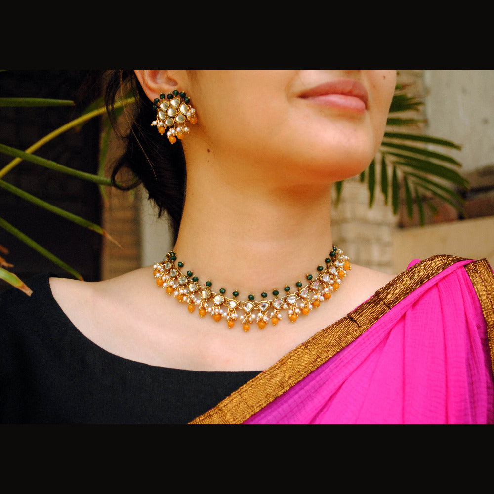 Kundan choker set in gold-tone with matching earrings and long bridal necklace, perfect for wedding functions , festive and bridal wear