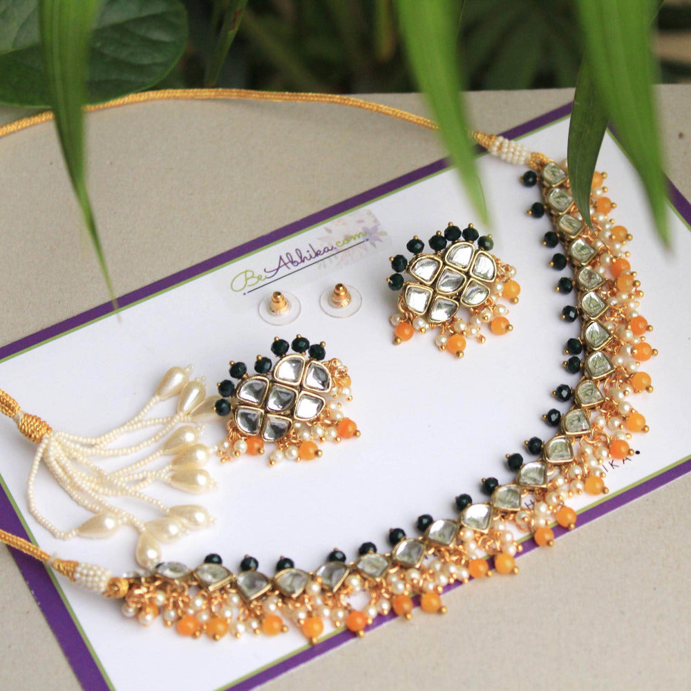 Kundan choker set in gold-tone with matching earrings and long bridal necklace, perfect for wedding functions , festive and bridal wear