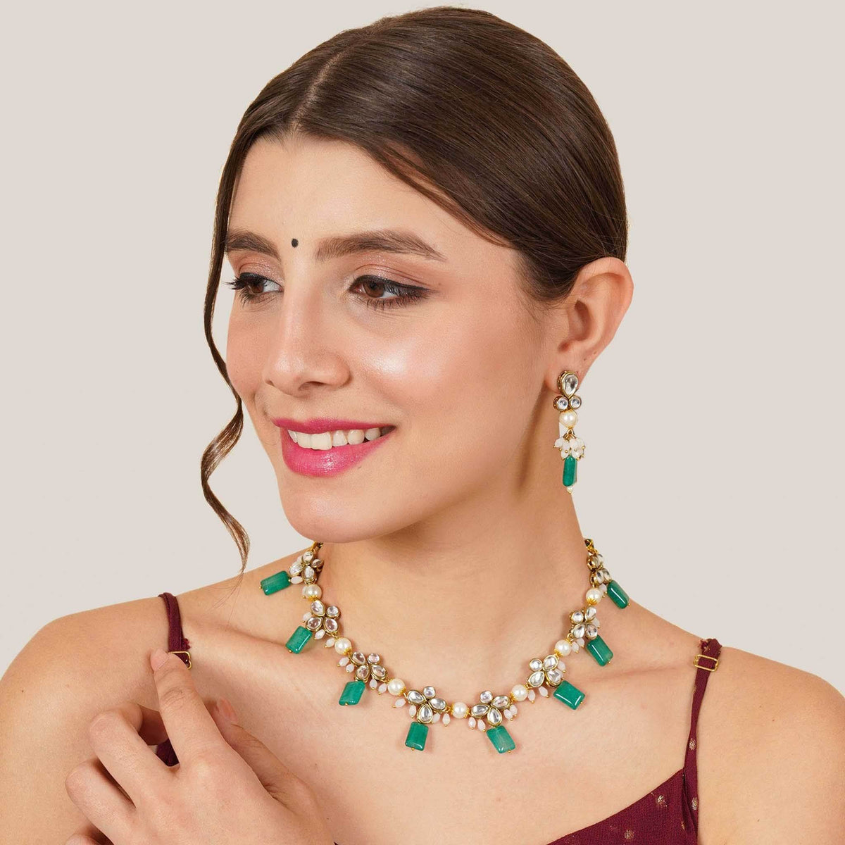 Kundan choker set in gold-tone with matching earrings and long bridal necklace, perfect for wedding functions , festive and bridal wear