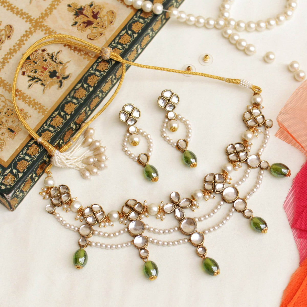 Kundan choker set in gold-tone with matching earrings and long bridal necklace, perfect for wedding functions , festive and bridal wear