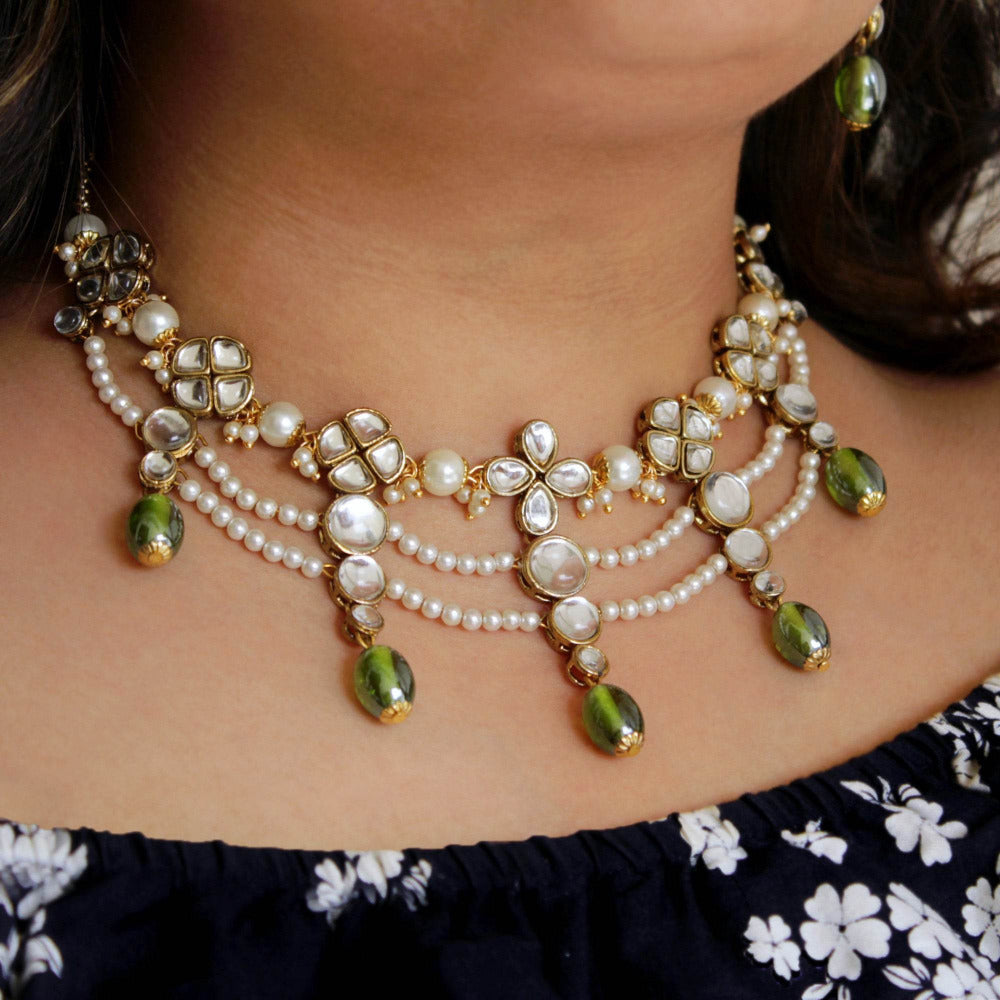 Kundan choker set in gold-tone with matching earrings and long bridal necklace, perfect for wedding functions , festive and bridal wear