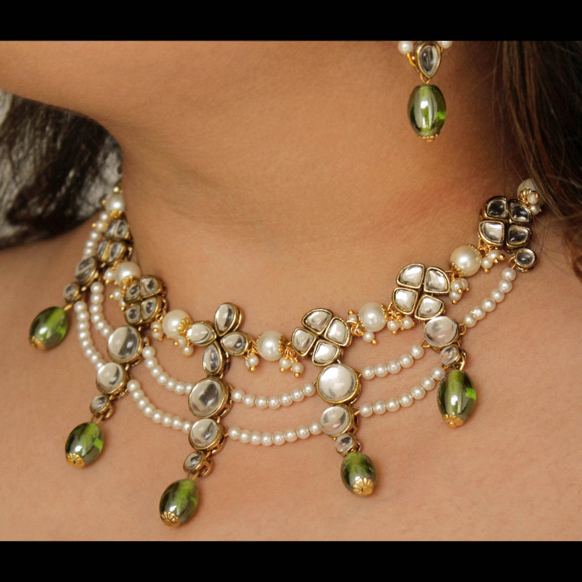 Kundan choker set in gold-tone with matching earrings and long bridal necklace, perfect for wedding functions , festive and bridal wear