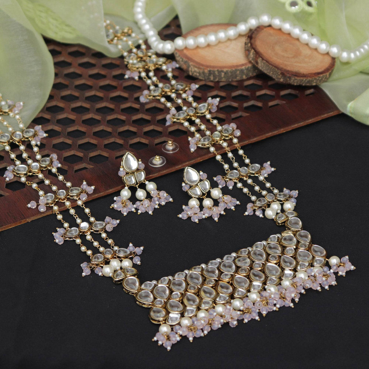 Kundan choker set in gold-tone with matching earrings and long bridal necklace, perfect for wedding functions , festive and bridal wear