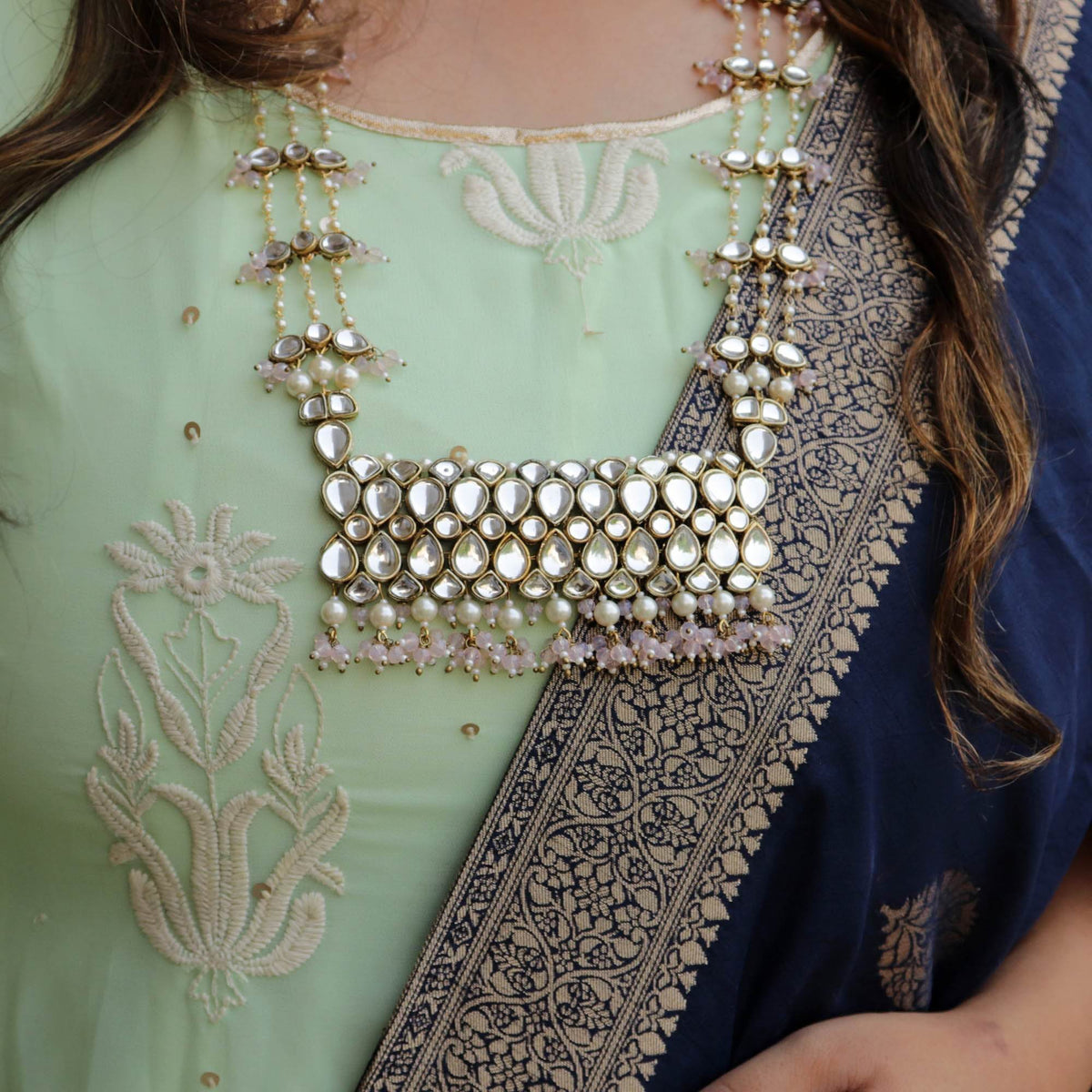 Kundan choker set in gold-tone with matching earrings and long bridal necklace, perfect for wedding functions , festive and bridal wear
