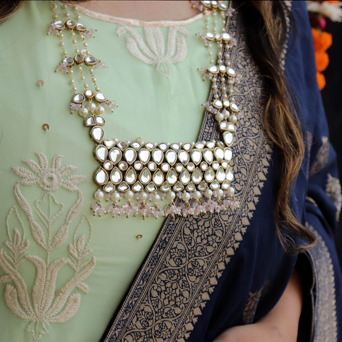 Kundan choker set in gold-tone with matching earrings and long bridal necklace, perfect for wedding functions , festive and bridal wear